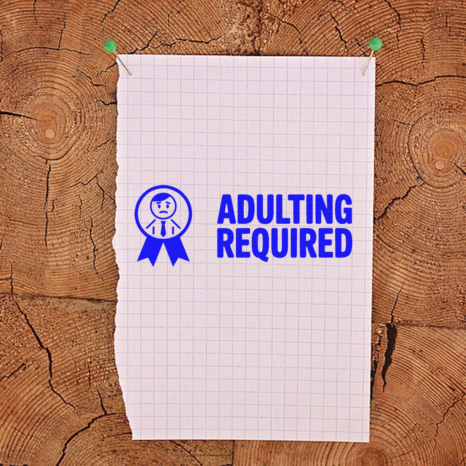 Adulting Required rubber stamp design in blue on pinned graph paper, perfect for planners, office use, and crafts.