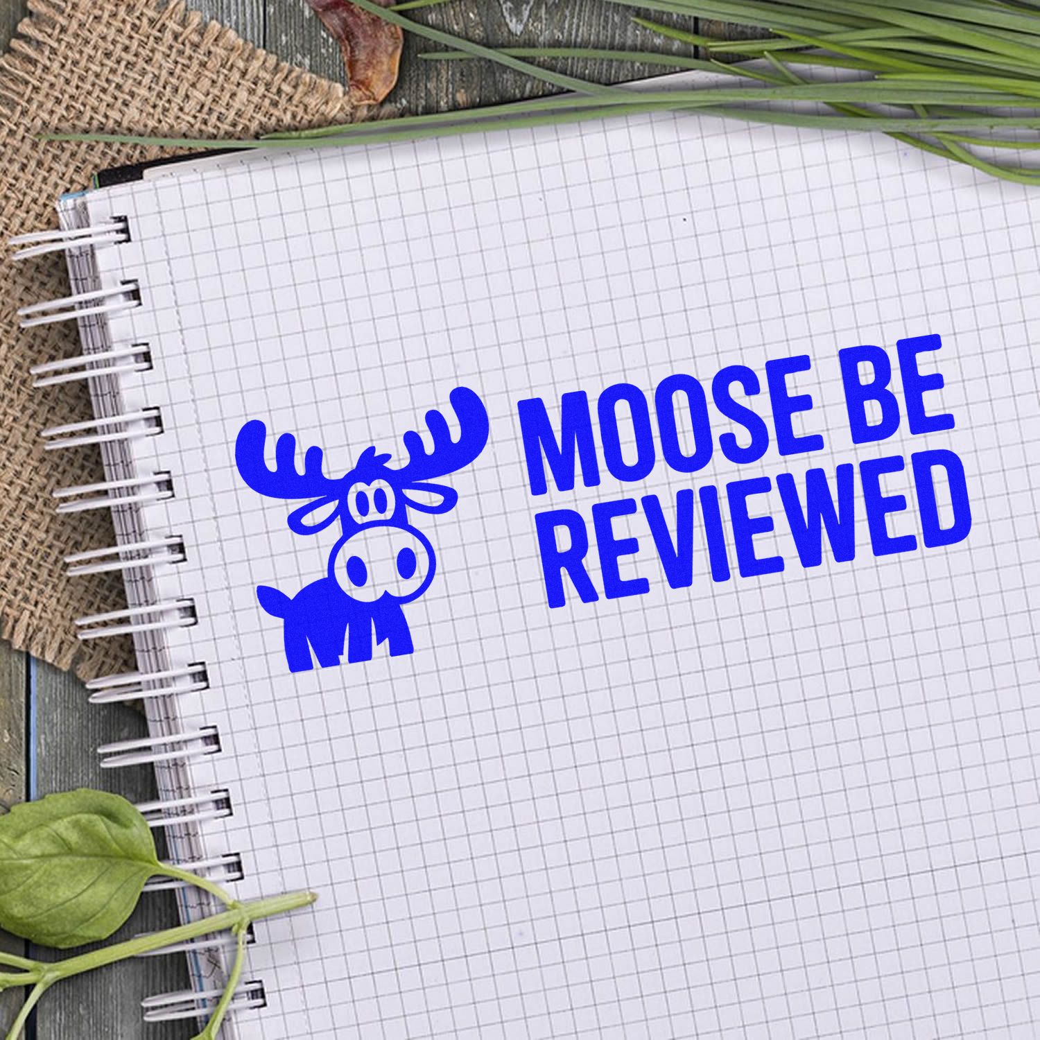 Moose be reviewed rubber stamp design with playful moose graphic and bold blue text for approval or office review.