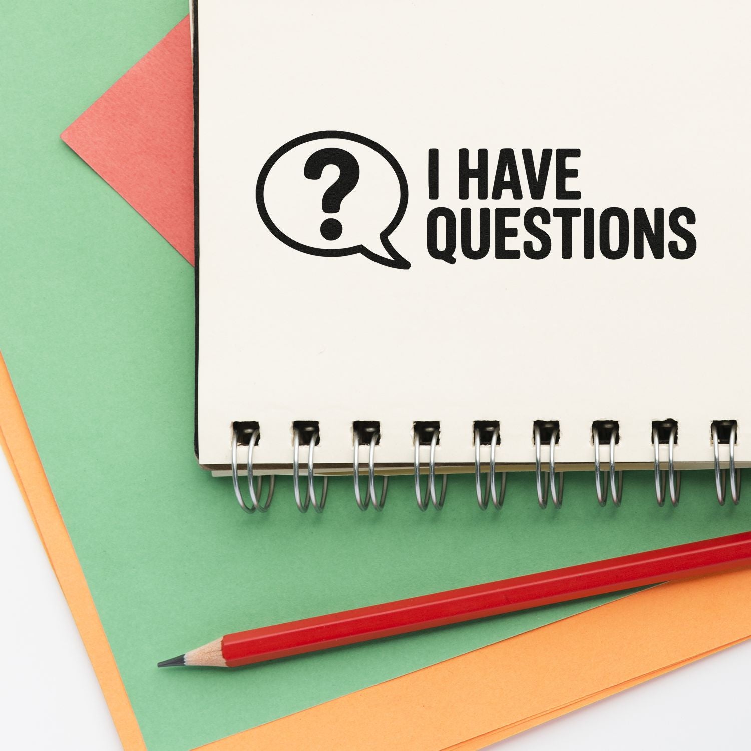 I Have Questions rubber stamp design with question mark speech bubble on notebook, ideal for office, school, or planner use.