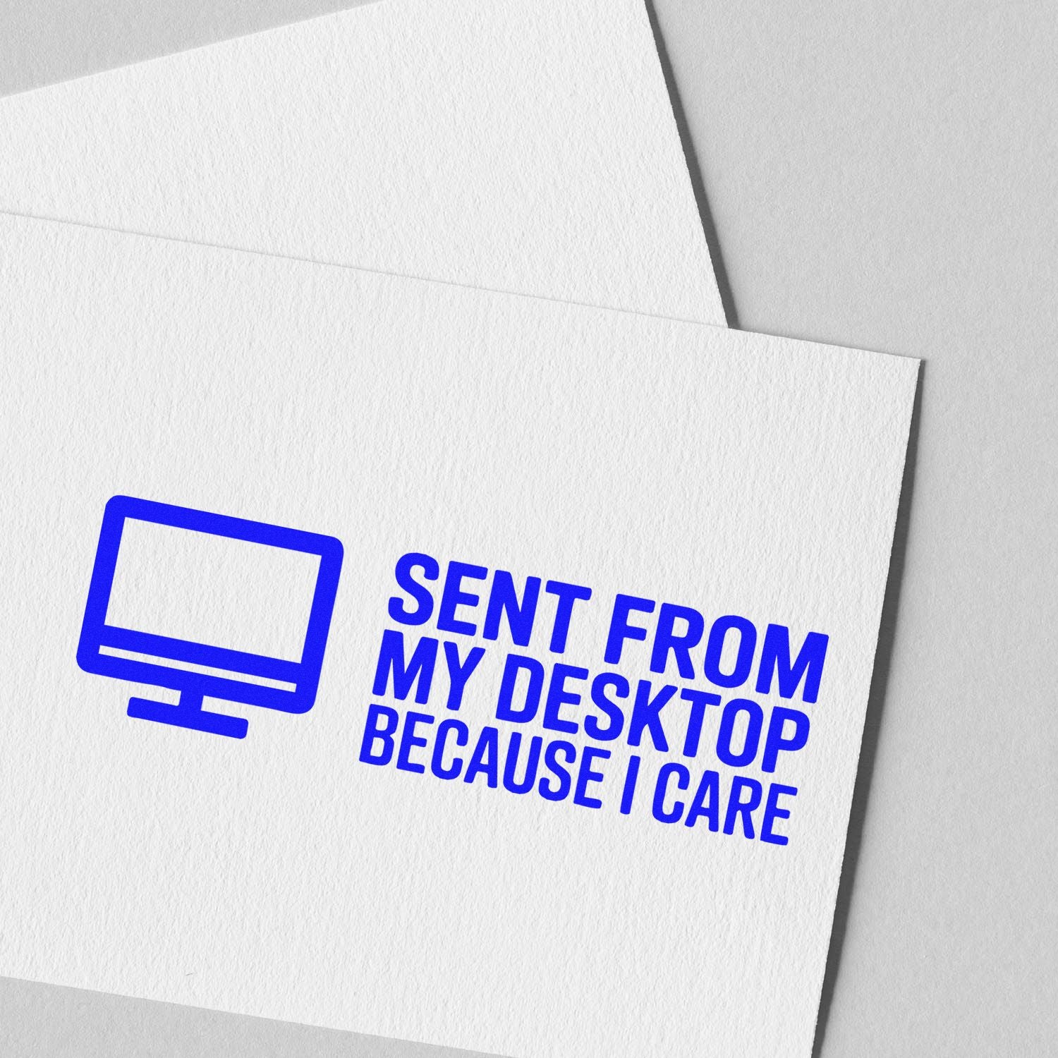 Custom rubber stamp design on envelope reading Sent from My Desktop Because I Care with computer icon.