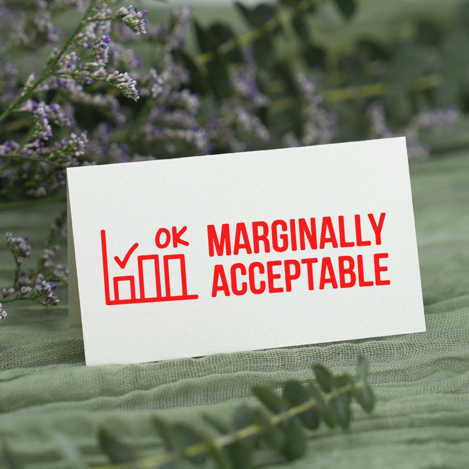 Humorous custom rubber stamp design with OK Marginally Acceptable text and chart icon for office approval.
