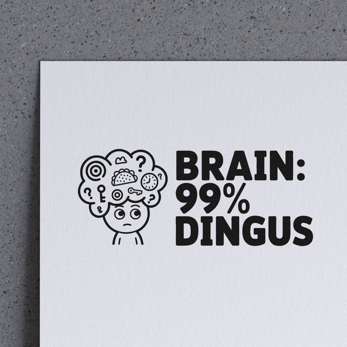 Humorous custom rubber stamp reading BRAIN: 99% DINGUS with cartoon brain icon on white paper.