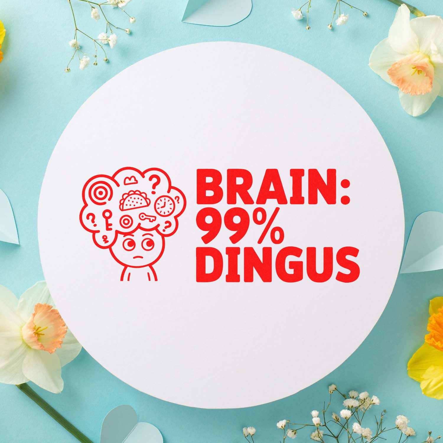 Custom rubber stamp design with brain icon and bold red text Brain: 99% Dingus on a floral craft background.