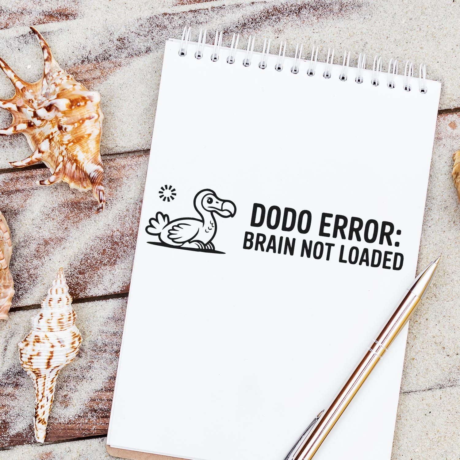 Humorous rubber stamp design reading Dodo Error: Brain Not Loaded on a notebook, ideal for novelty office stamps.