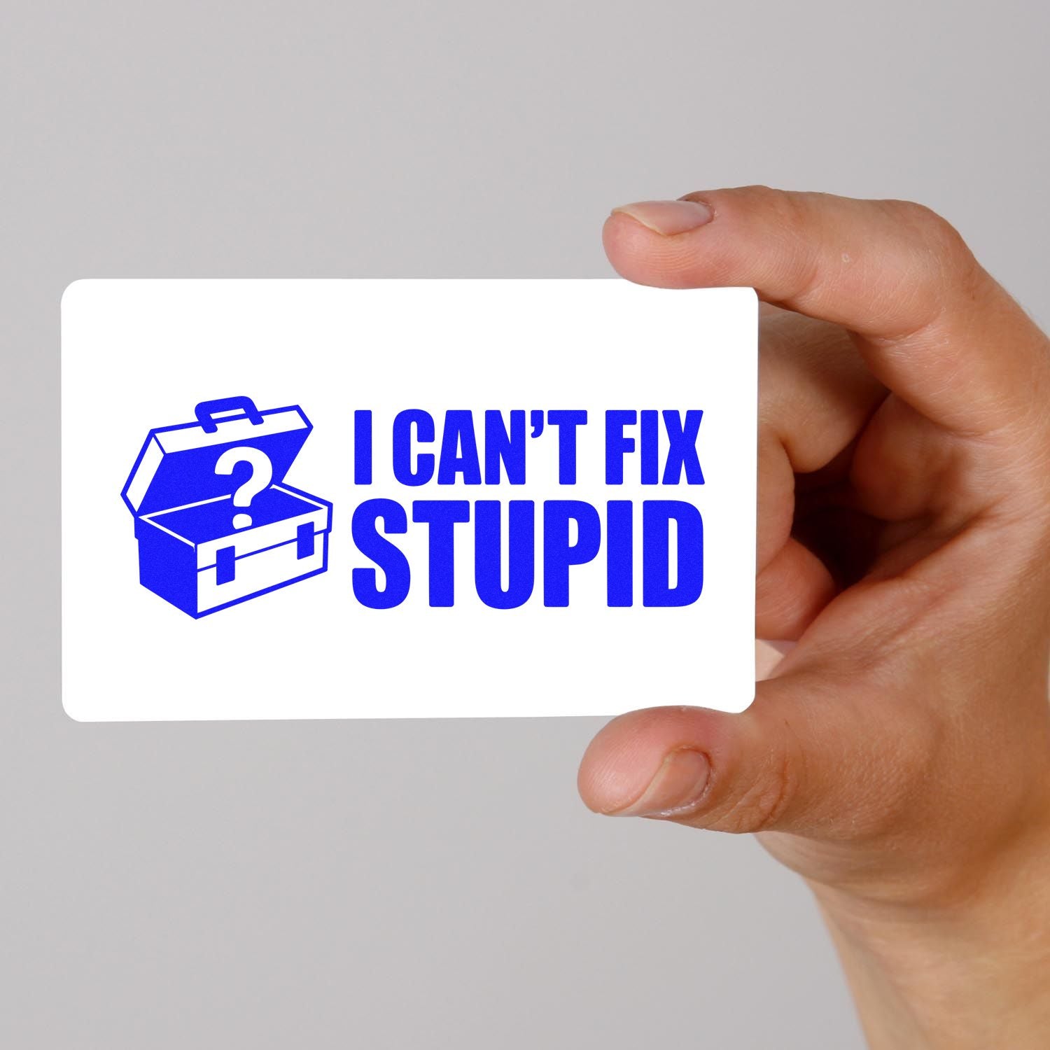 Custom rubber stamp with humorous I Cant Fix Stupid message and toolbox icon, shown held in hand.