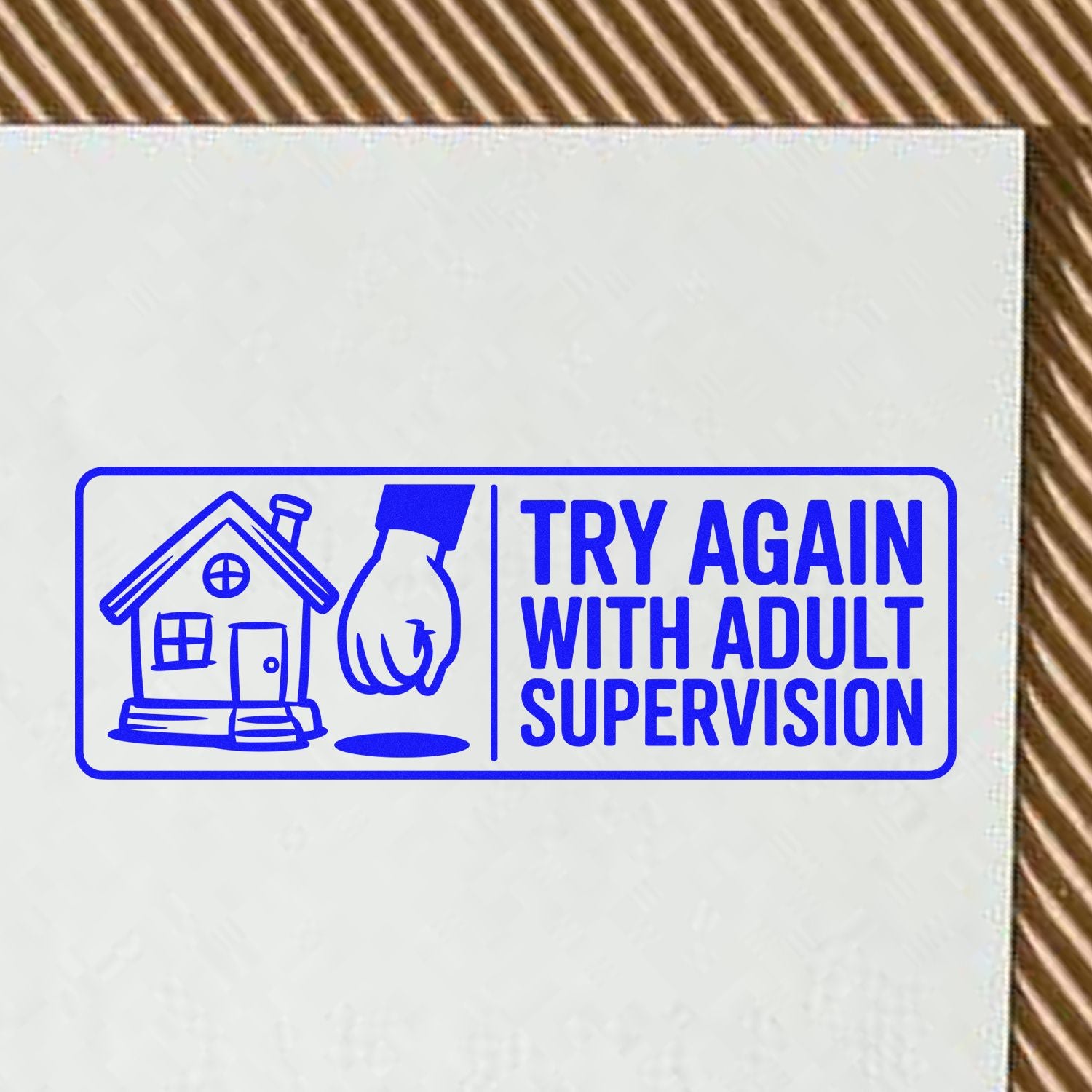 Blue educational rubber stamp with house icon and "Try Again With Adult Supervision" text on paper.