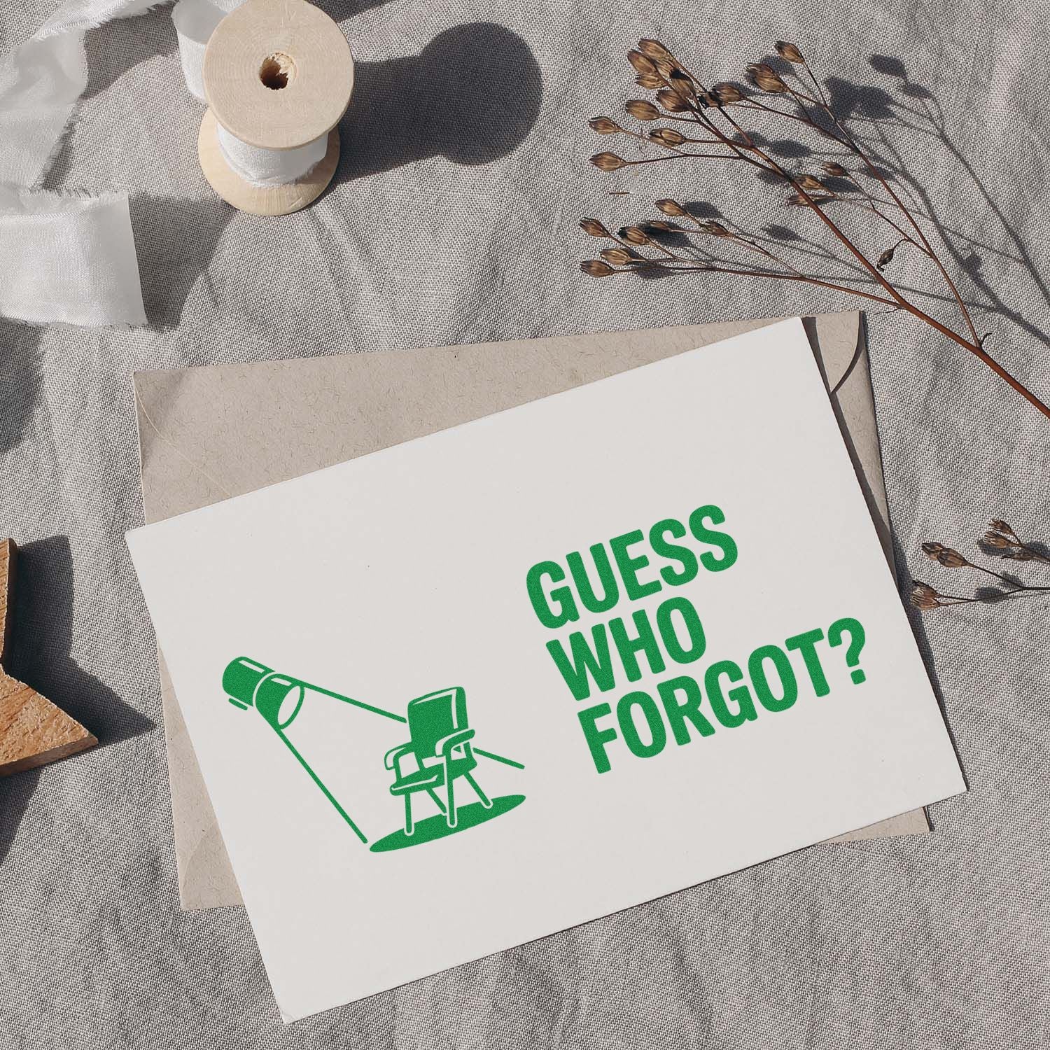 Custom rubber stamp design reading Guess Who Forgot? on a greeting card, with envelope and stationery styling.