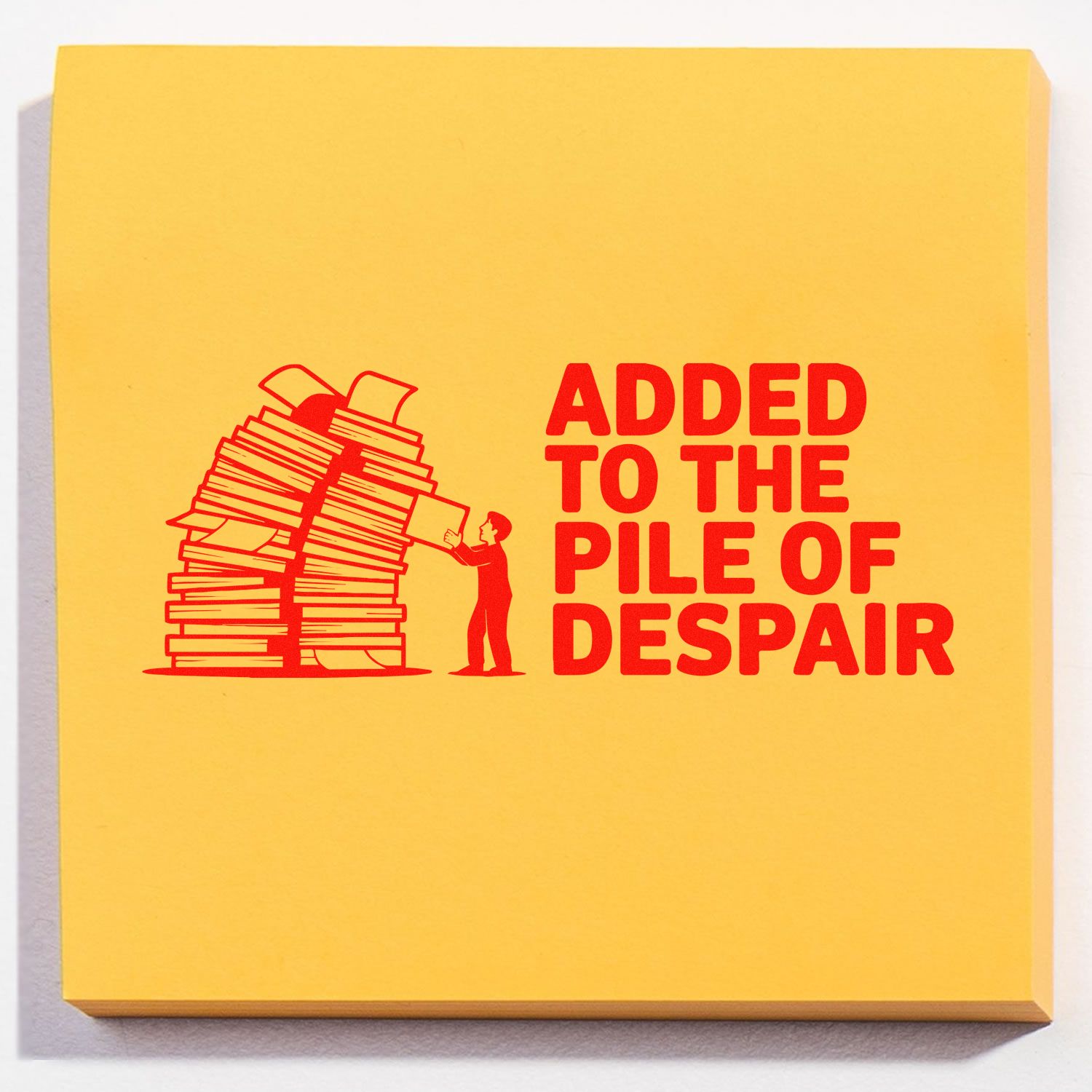 Rubber stamp design reading Added to the Pile of Despair with a stack of papers, ideal for office humor rubber stamps.