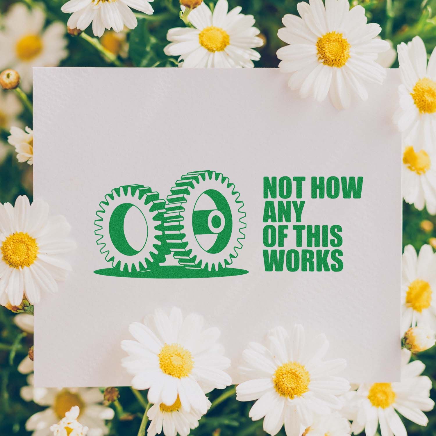 Custom rubber stamp design with gears and Not how any of this works slogan on a daisy background.