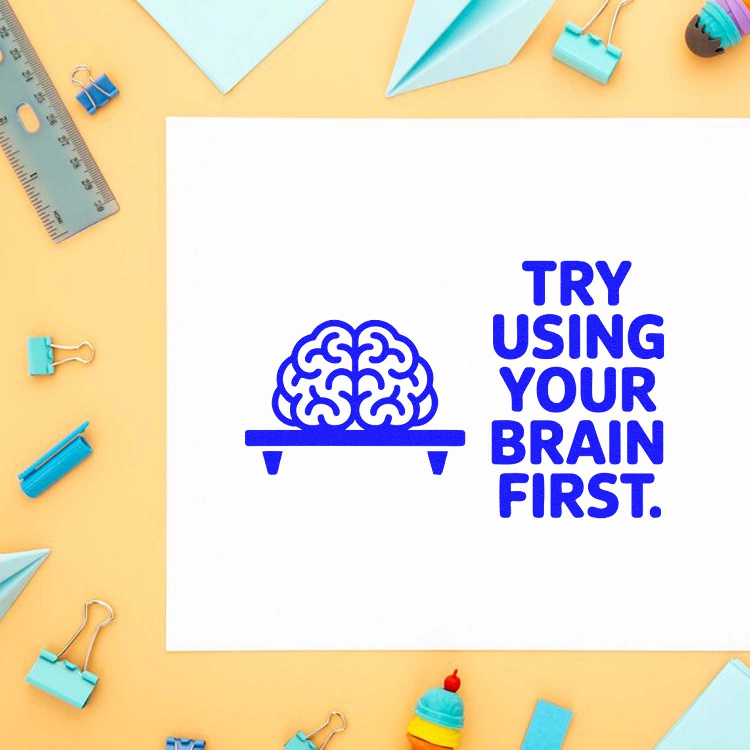 Rubber stamp design with brain icon and Try using your brain first text on a stationery-themed background.