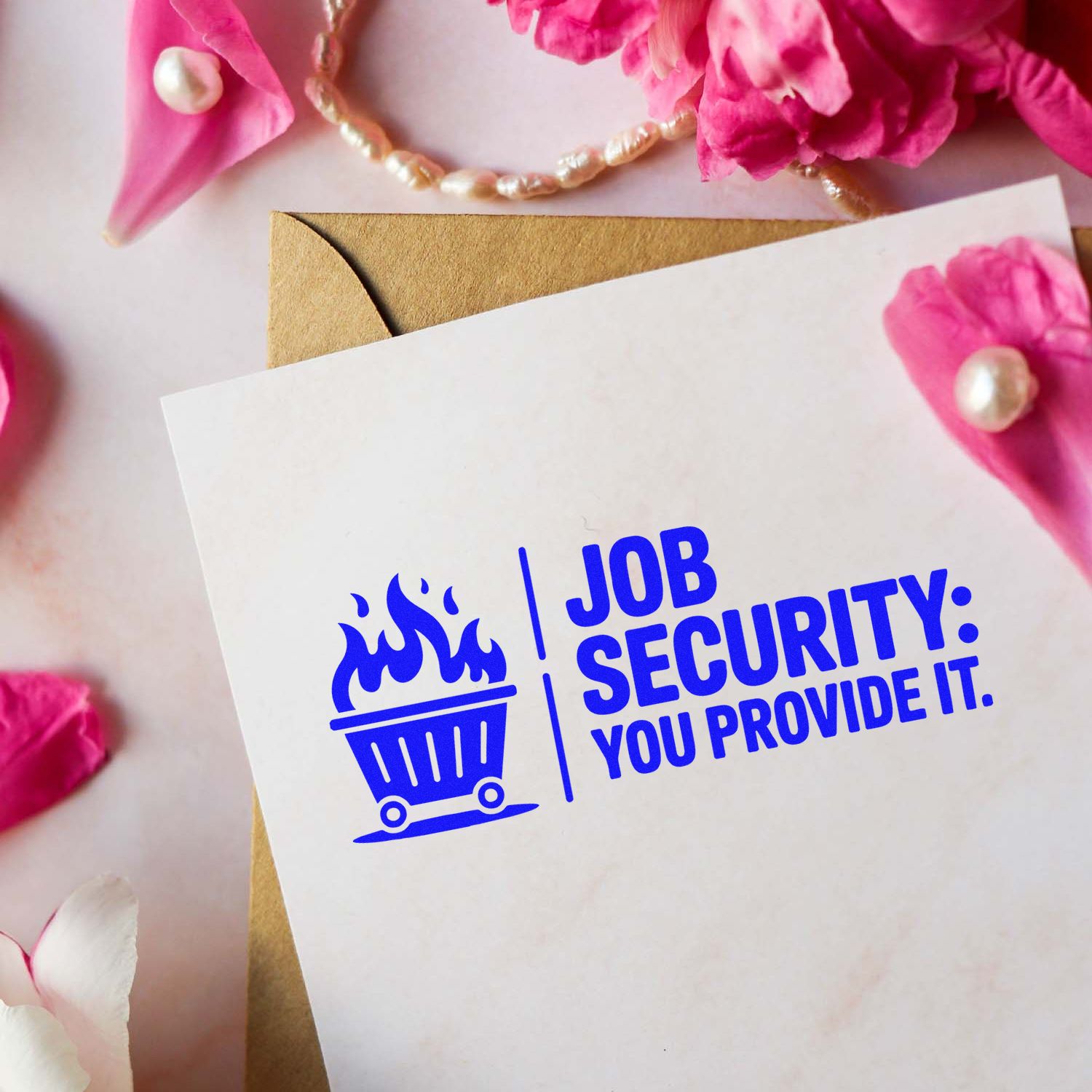 Humorous Job Security You Provide It rubber stamp design mockup on a card with envelope and floral stationery.