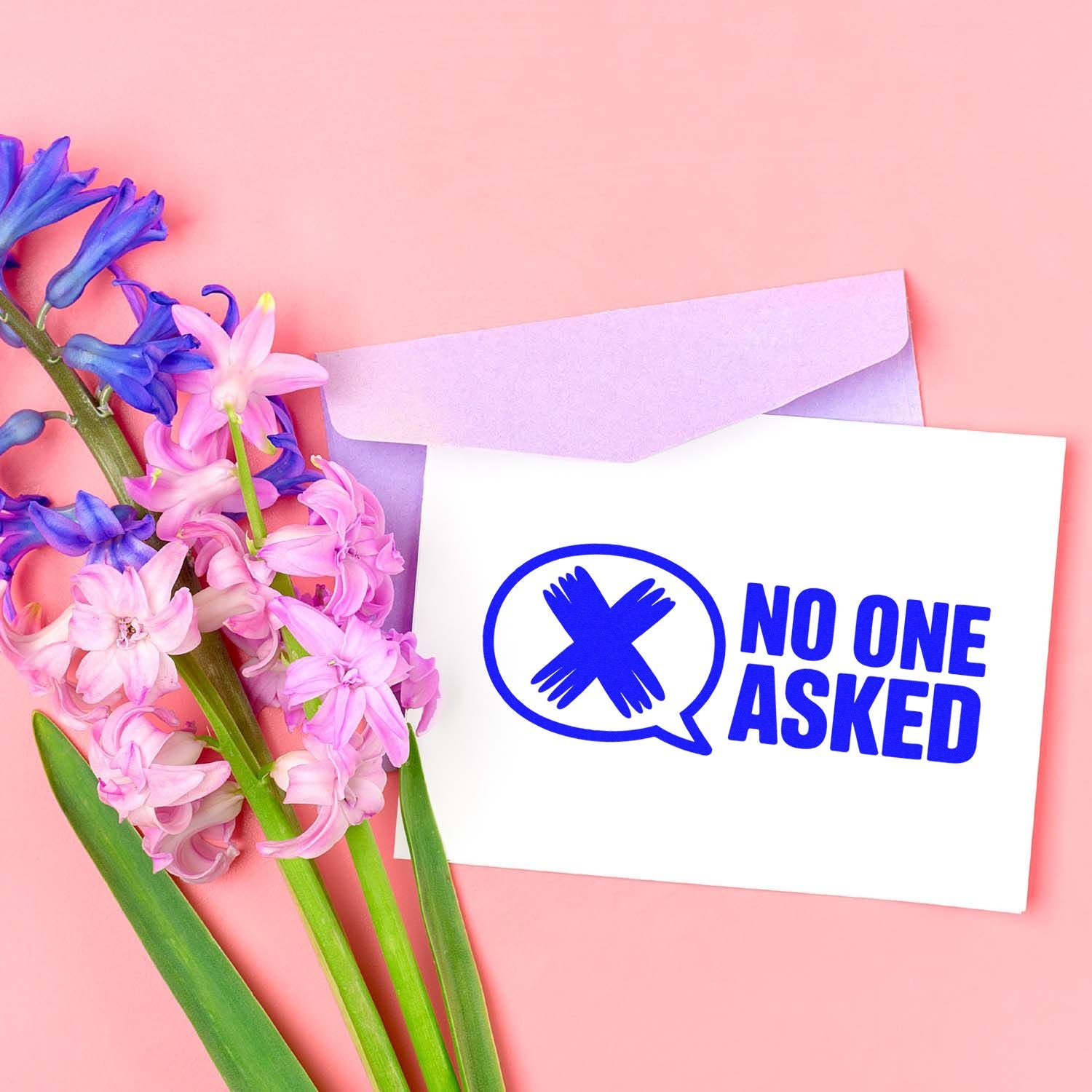 Humorous No One Asked rubber stamp on greeting card with envelope and spring flowers, ideal for handmade stationery.