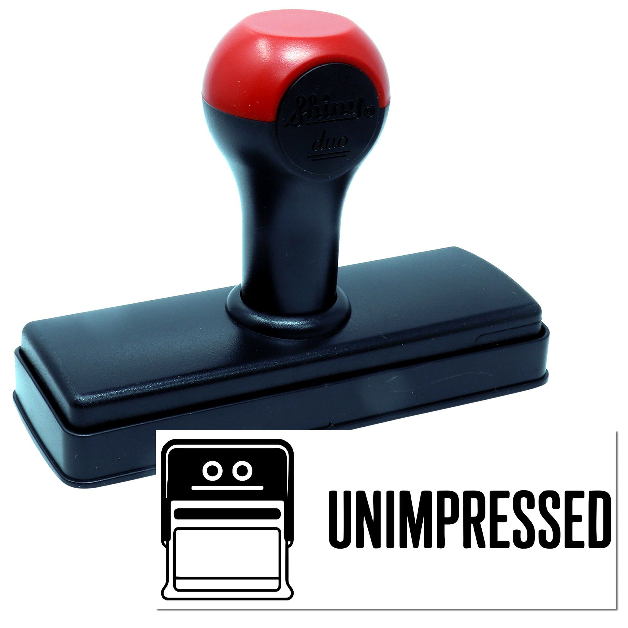 Self-inking rubber stamp with red handle and black base, featuring an UNIMPRESSED impression for custom office use.