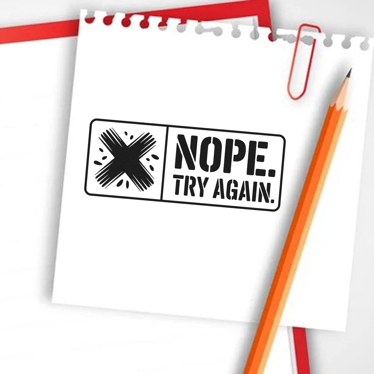 Nope, Try Again rubber stamp on notebook paper for rejection, correction, or feedback messages.