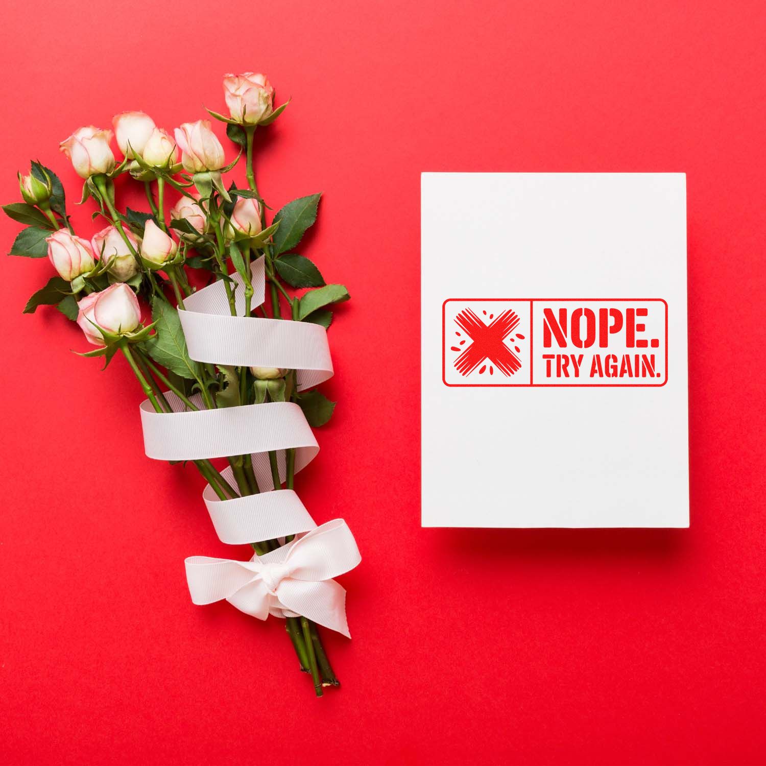 Nope Try Again rubber stamp on card beside roses bouquet, bold rejection stamp for crafts, stationery, and greeting cards.