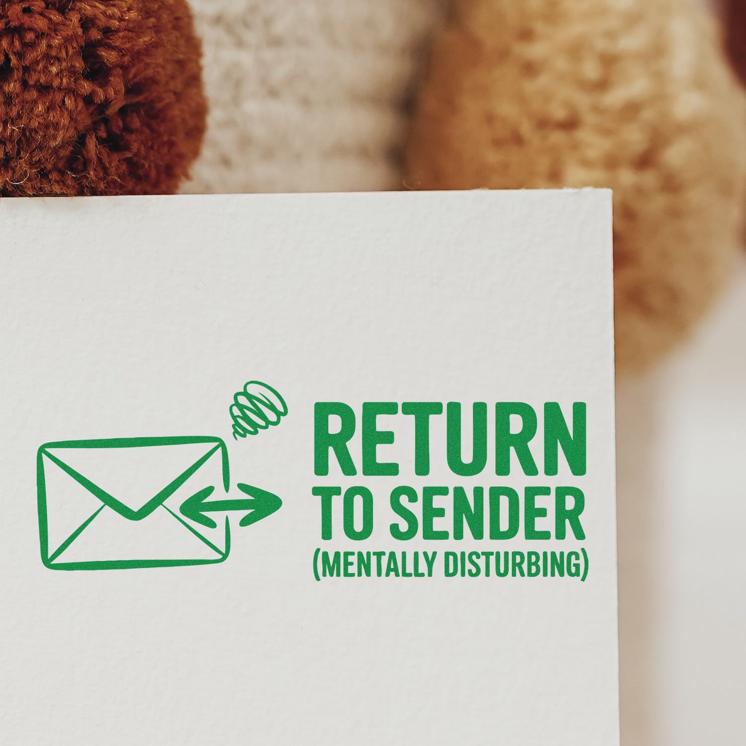 Green rubber stamp design with envelope icon and Return to Sender (Mentally Disturbing) text for mail and packaging.