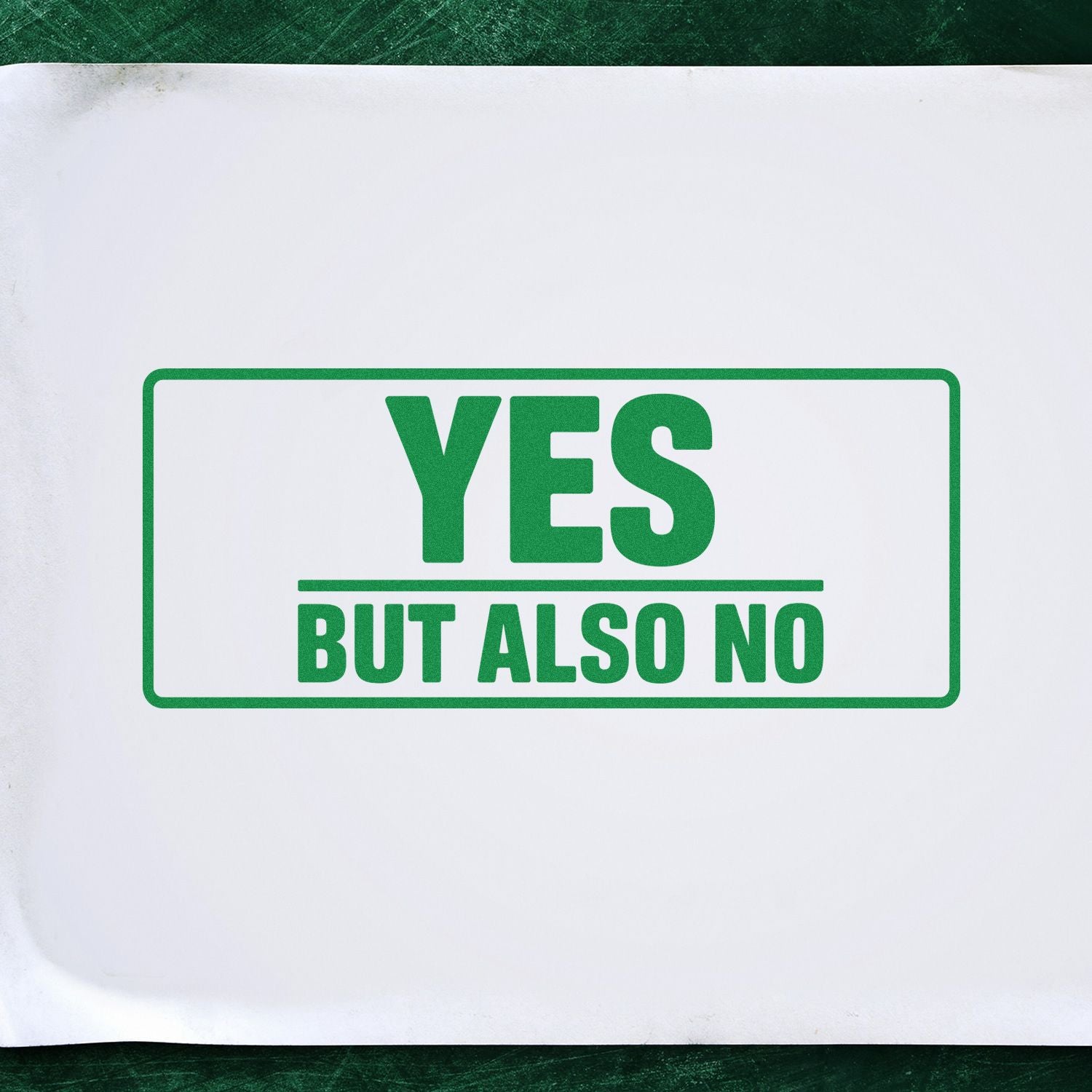 Green rubber stamp reading YES BUT ALSO NO on white paper, ideal for custom office or novelty stamp designs.
