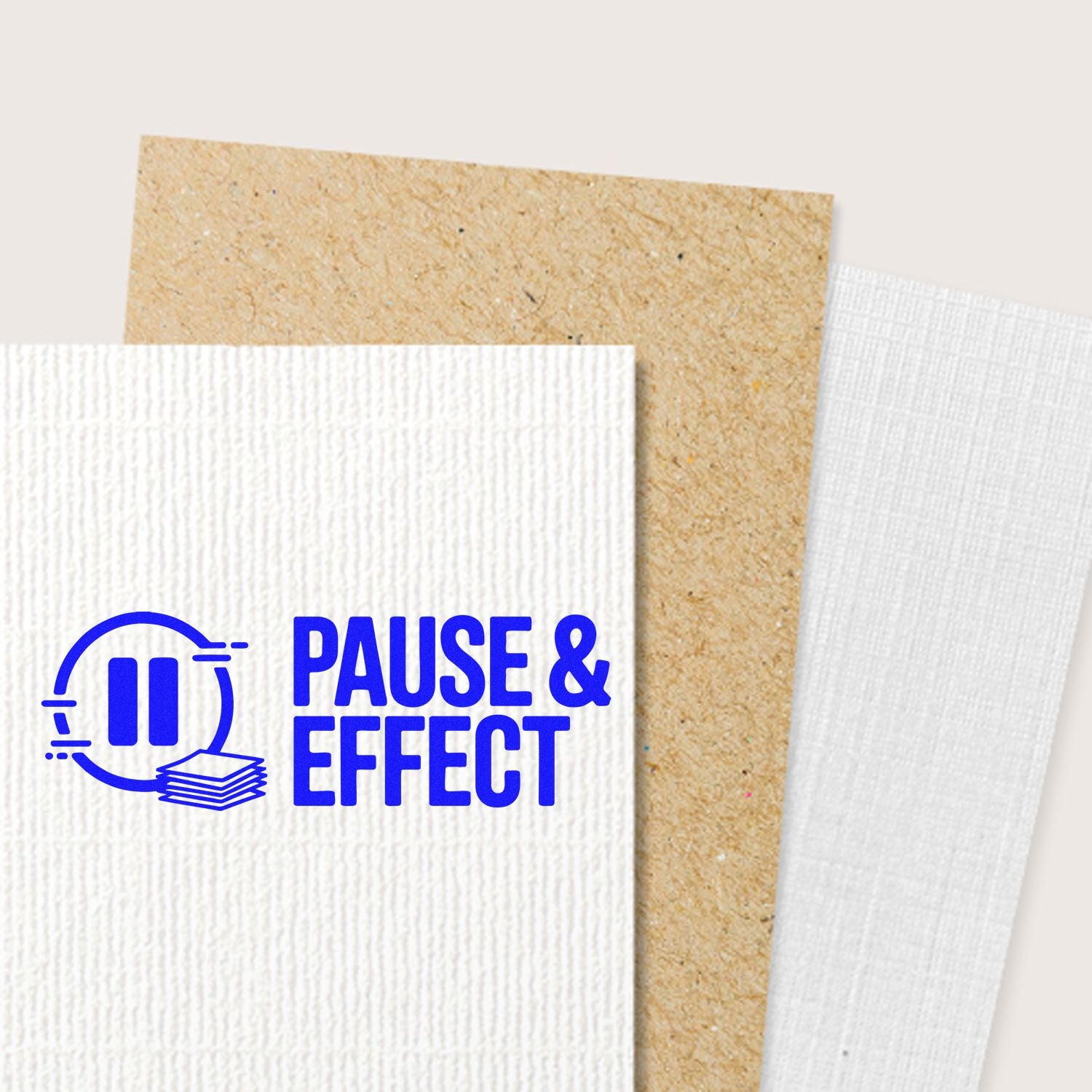 Custom rubber stamp logo mockup with Pause & Effect imprint on textured paper stationery.