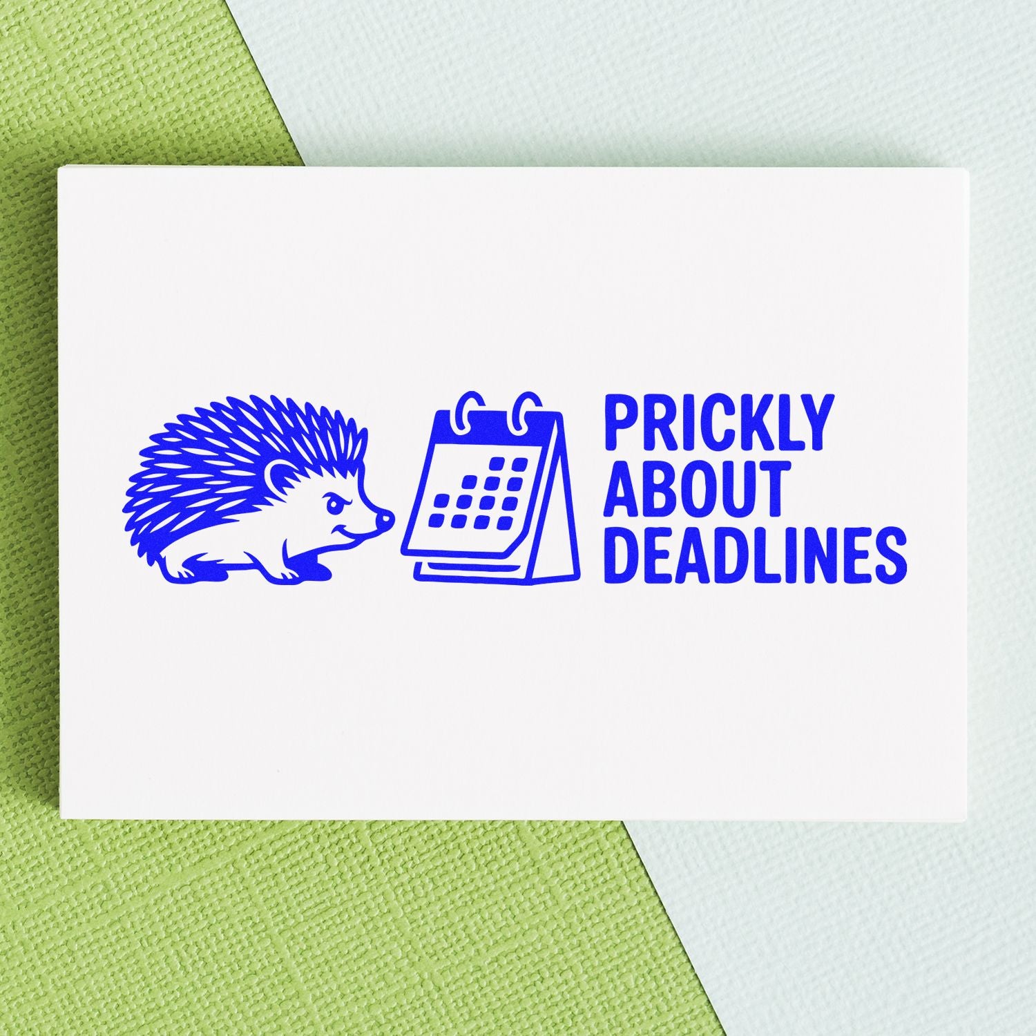 Blue rubber stamp design with hedgehog and calendar reading Prickly About Deadlines for office planners
