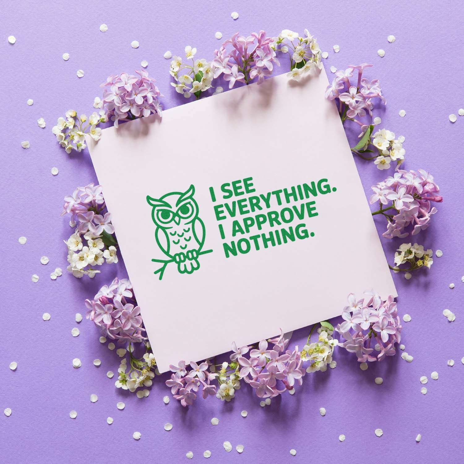 Green owl rubber stamp with I see everything, I approve nothing quote on a floral lavender background.