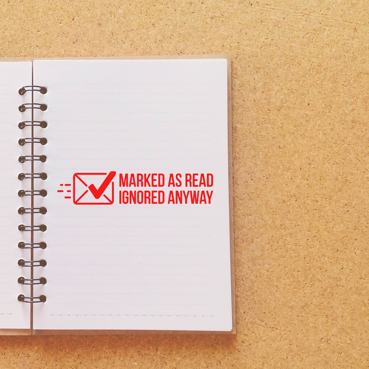 Humorous red rubber stamp impression reading Marked as Read, Ignored Anyway with envelope checkmark, ideal for office mail.