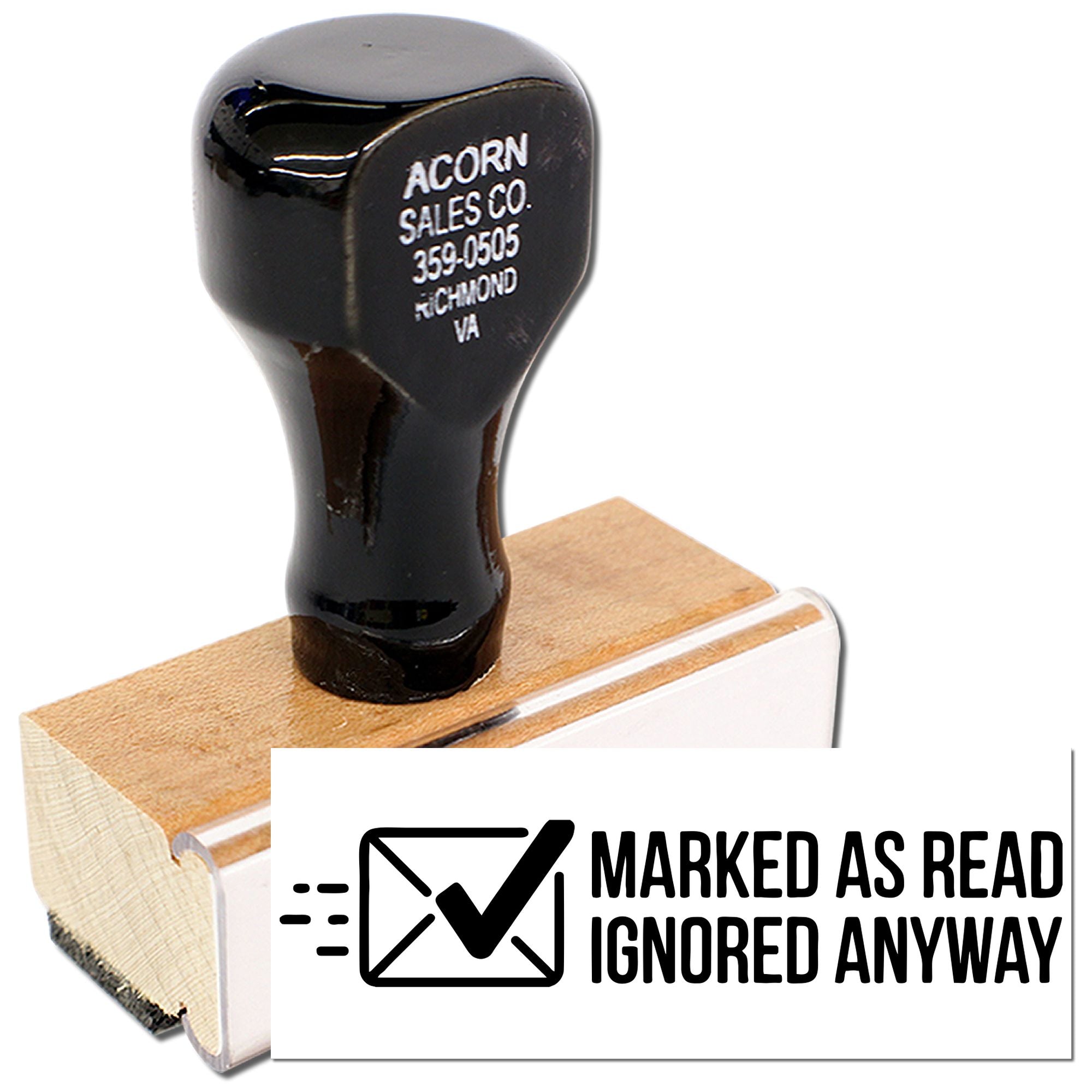 Wooden rubber stamp with Marked as read, ignored anyway message for office mail and document processing.