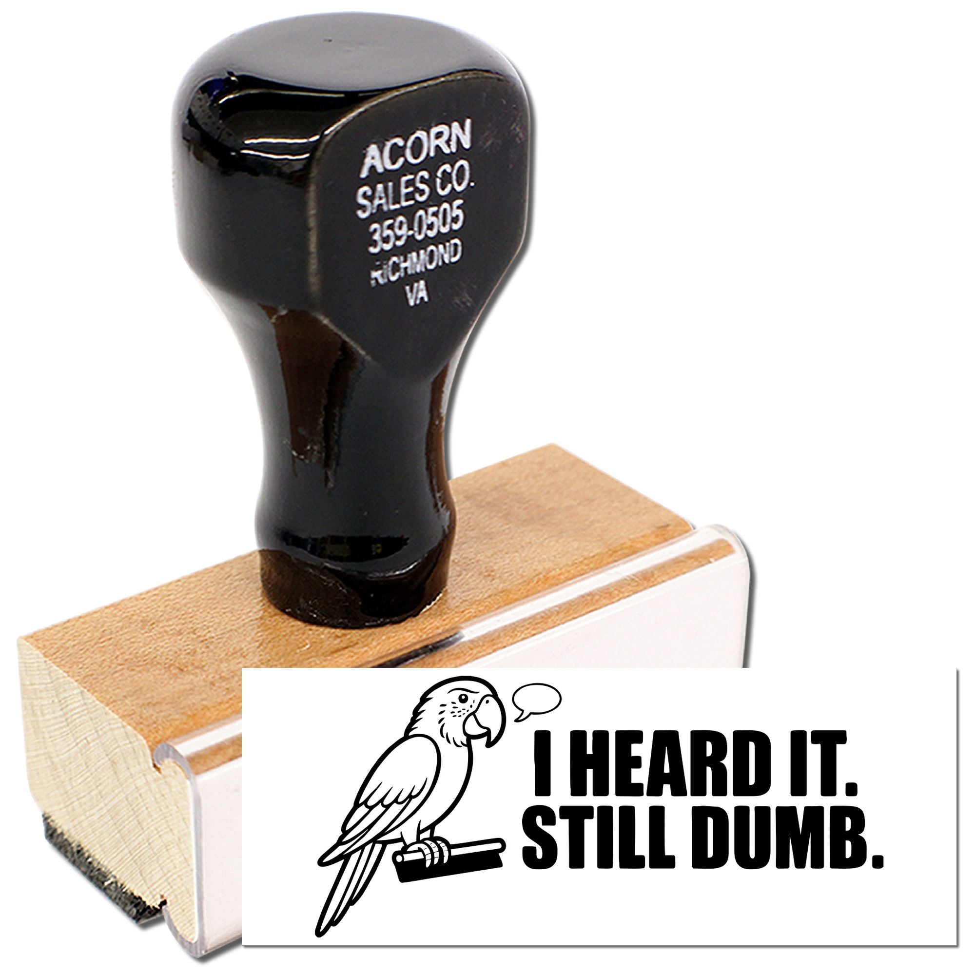 Wooden rubber stamp with parrot graphic and I Heard It. Still Dumb. slogan for funny office messaging.