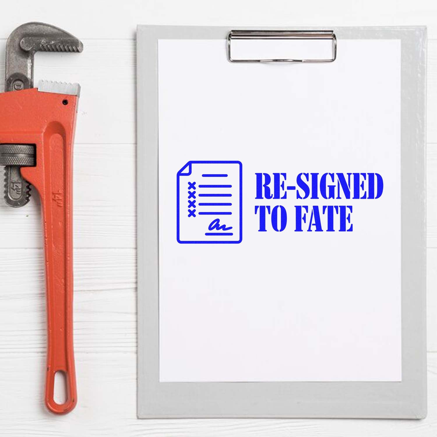 Custom rubber stamp design reading Re-Signed to Fate with document icon, ideal for office humor and resignation.