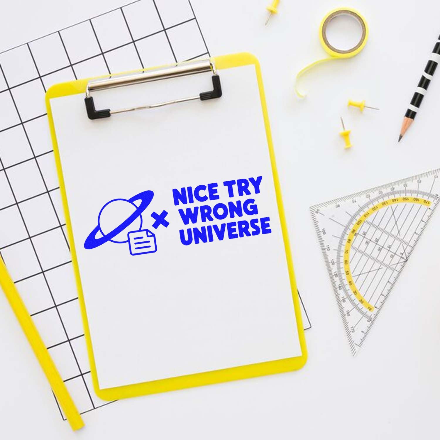 Nice Try Wrong Universe rubber stamp design on clipboard, a funny novelty stamp for office, school, and craft projects.