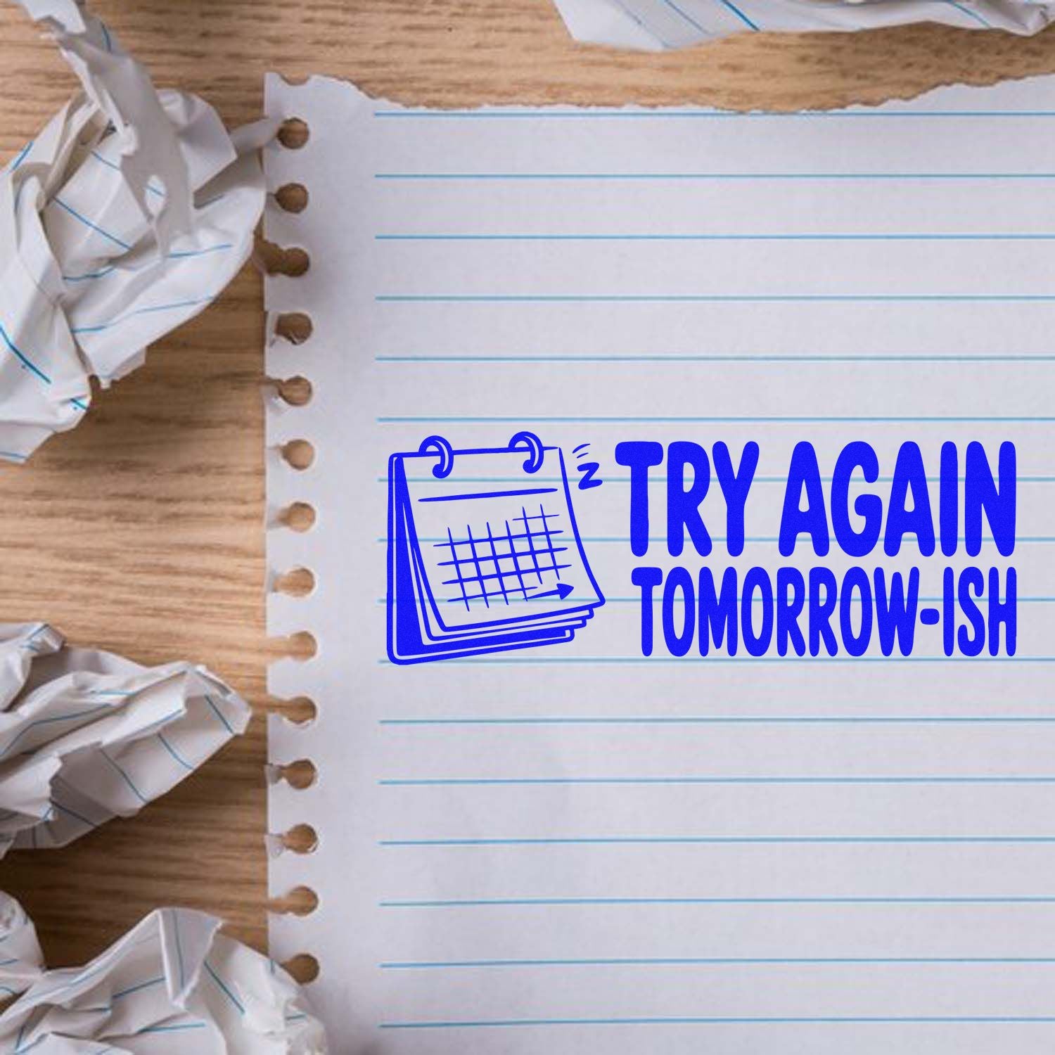 Humorous rubber stamp design reading Try Again Tomorrow-ish for office or teacher use on a lined notebook page.