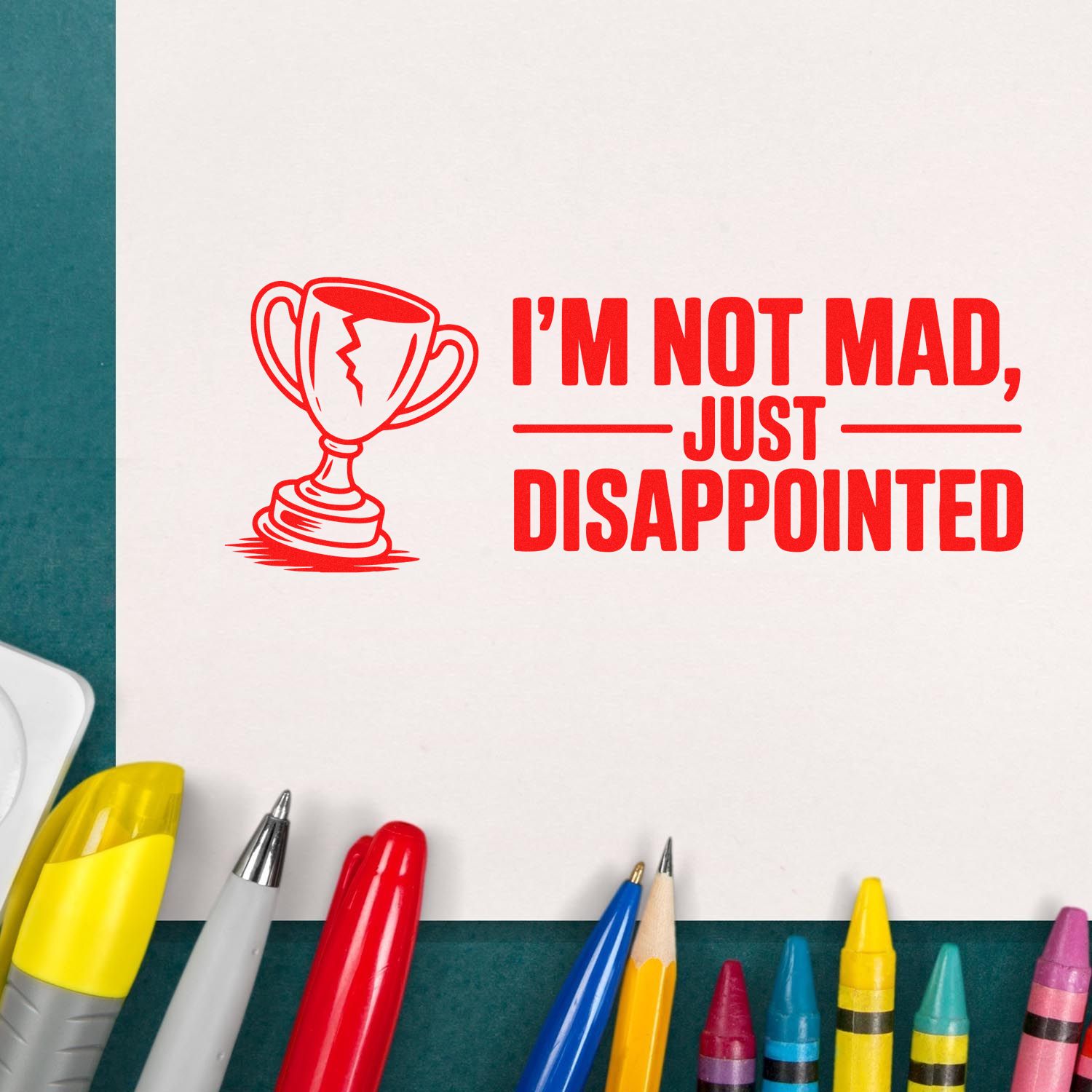 Custom rubber stamp design with trophy icon and quote, Im not mad, just disappointed, stamped in red on paper.