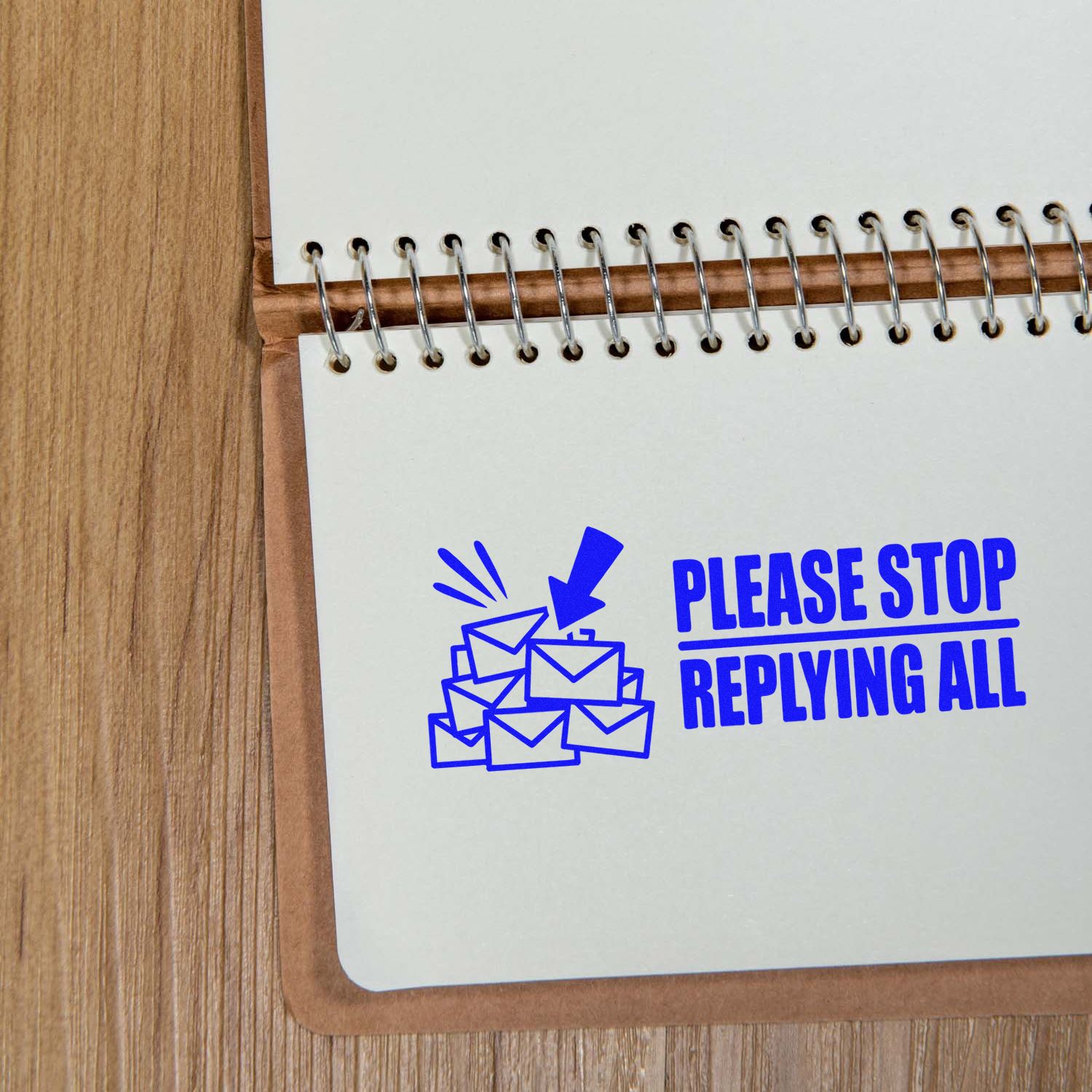 Blue custom rubber stamp reading Please Stop Replying All with envelope icon for office email humor.