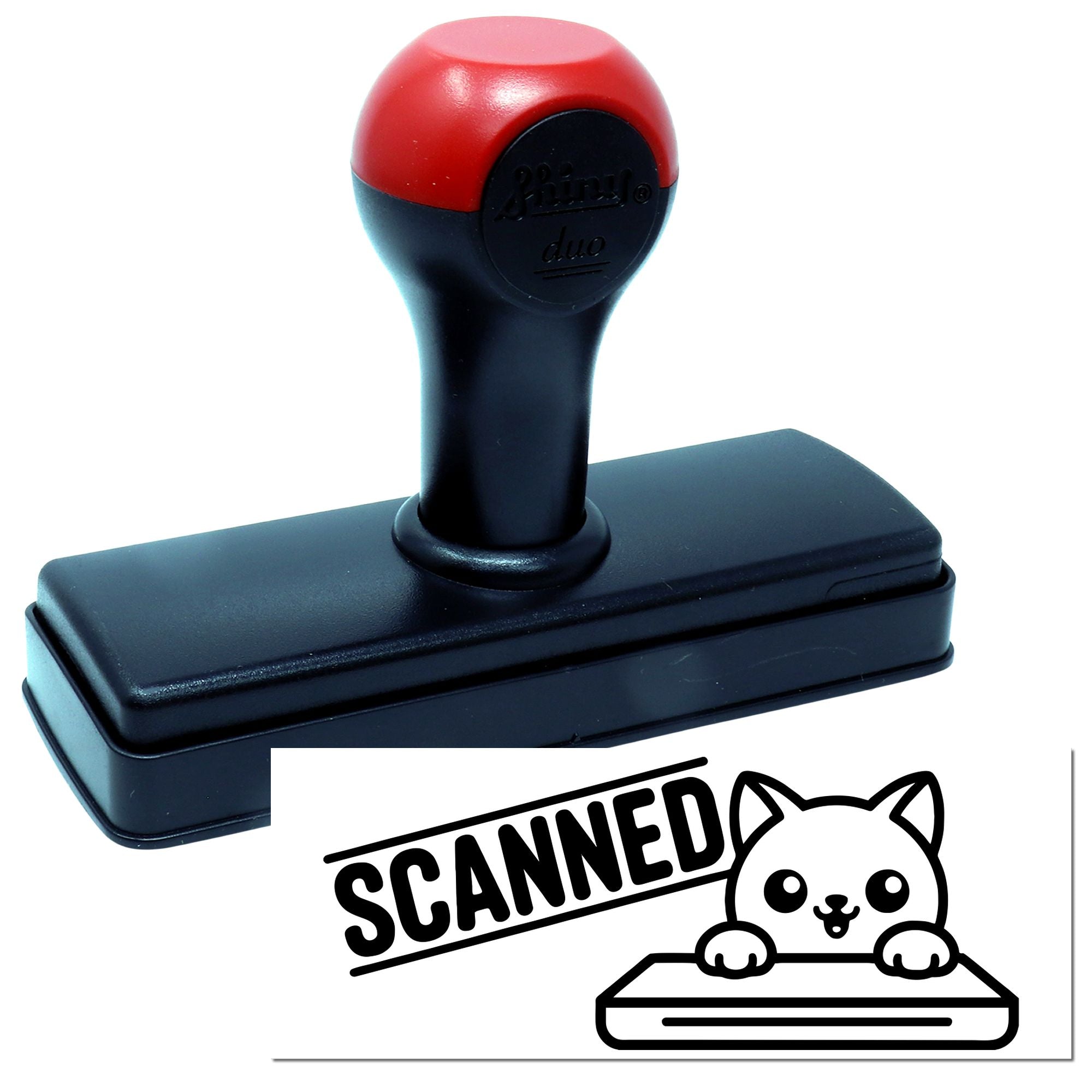 Self-inking rubber stamp with SCANNED cat design for office document marking.