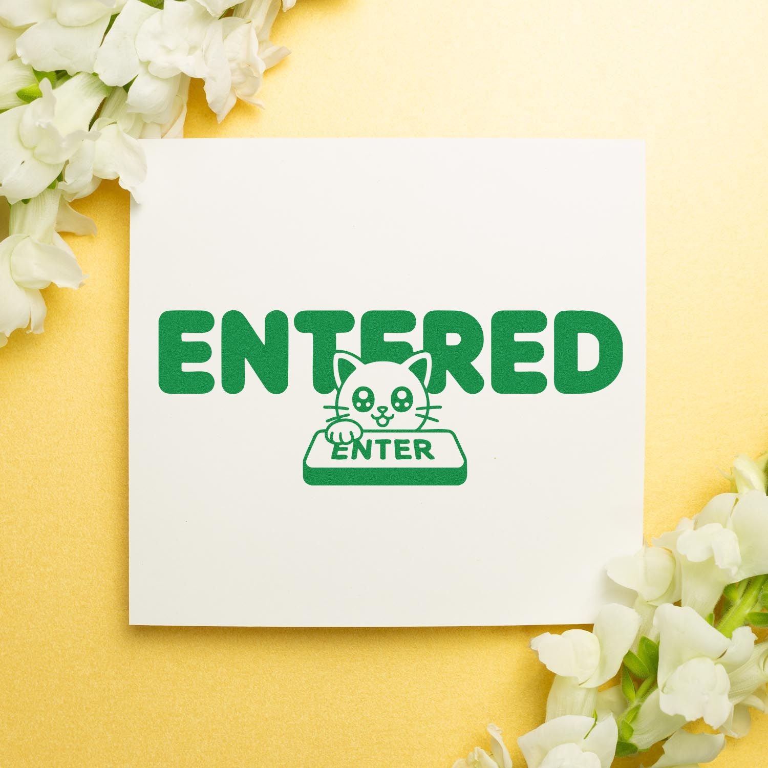 Entered rubber stamp design with cute cat pressing enter key, green office approval stamp on yellow floral background