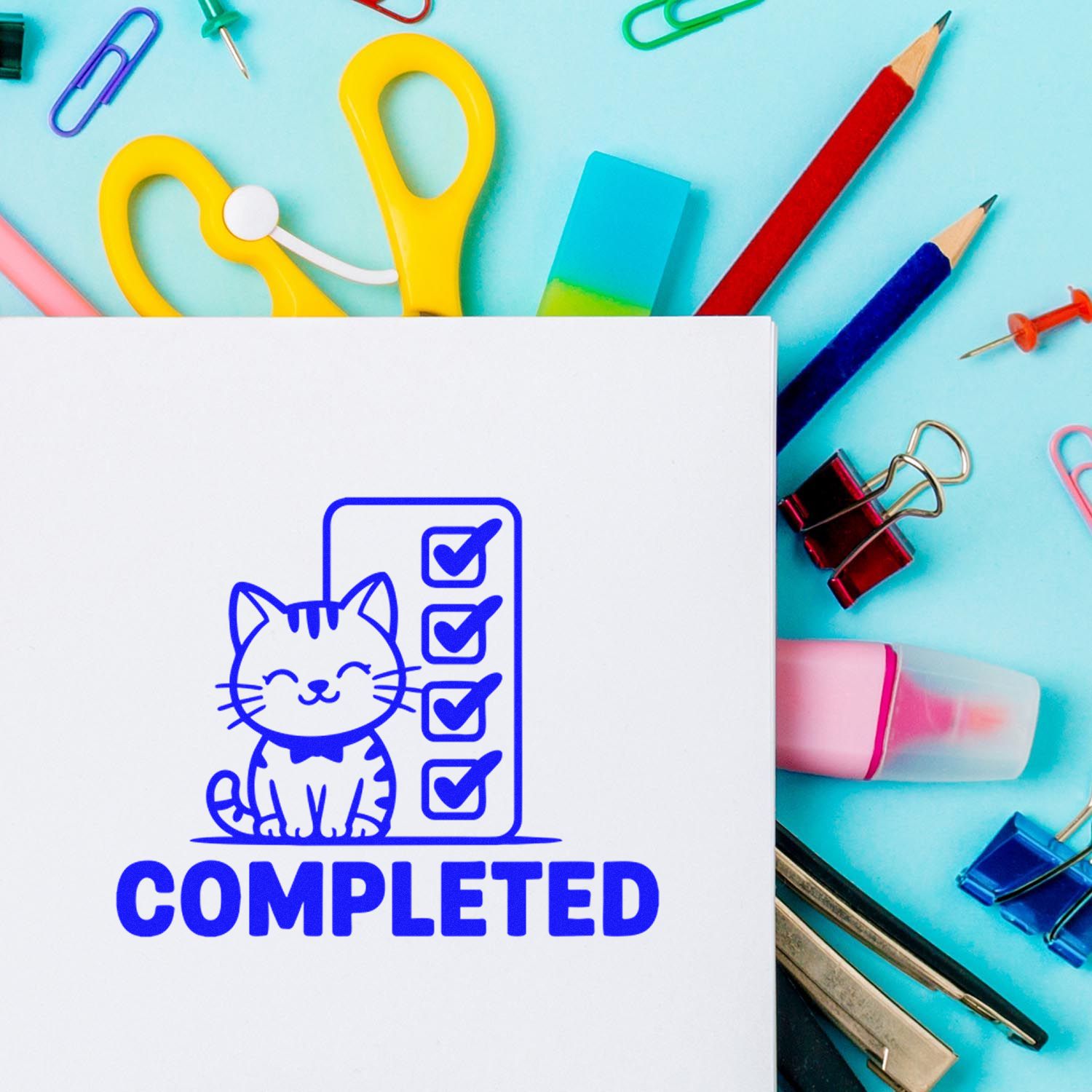 Custom rubber stamp with cat checklist and COMPLETED text for finished tasks, shown with colorful office supplies.