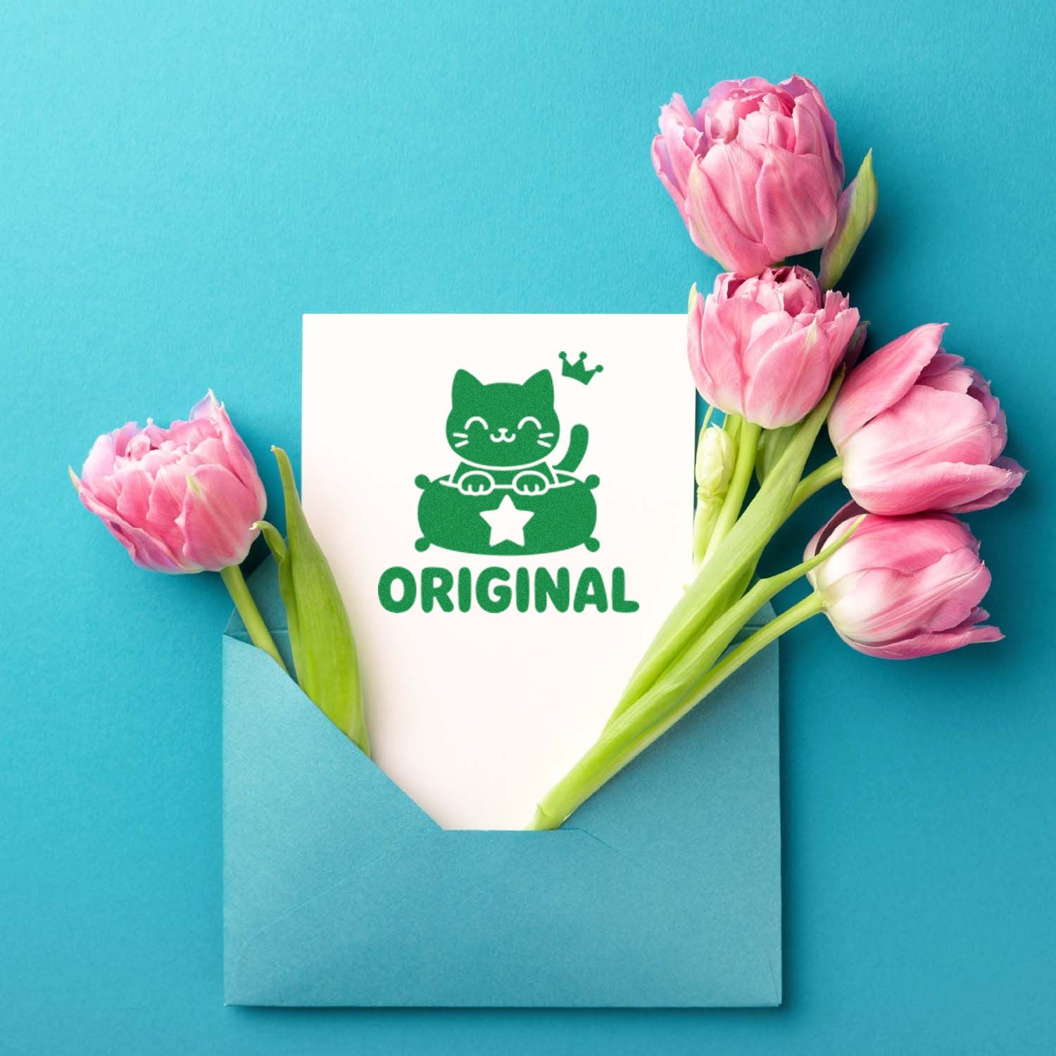 Original cat rubber stamp design on a greeting card, framed by pink tulips for handmade stationery and craft branding.