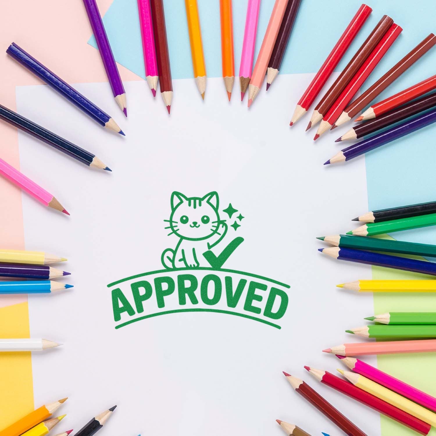 Approved cat rubber stamp on white paper, framed by colorful pencils for school, craft, and stationery branding
