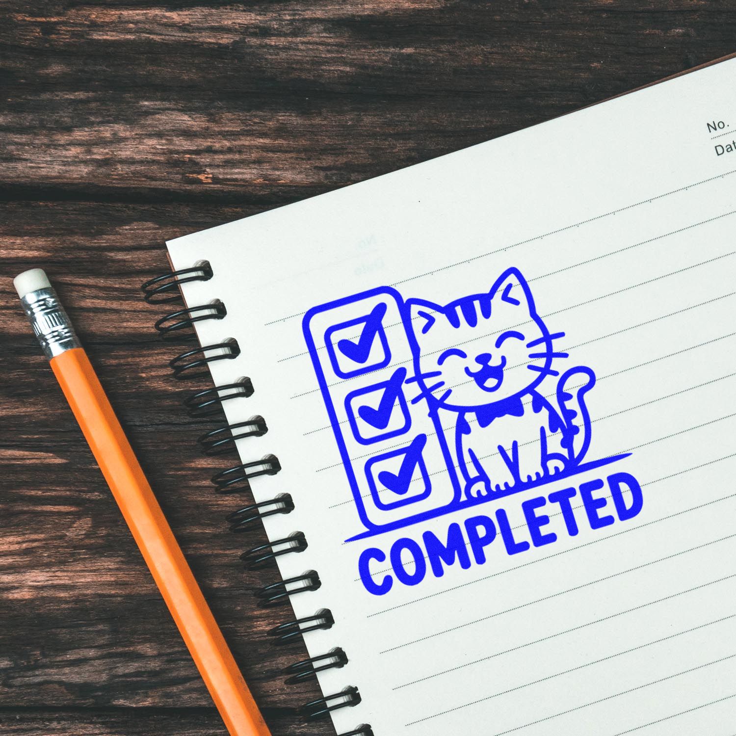 Blue completed rubber stamp on notebook with checklist, ideal for task tracking, approval, and office organization.
