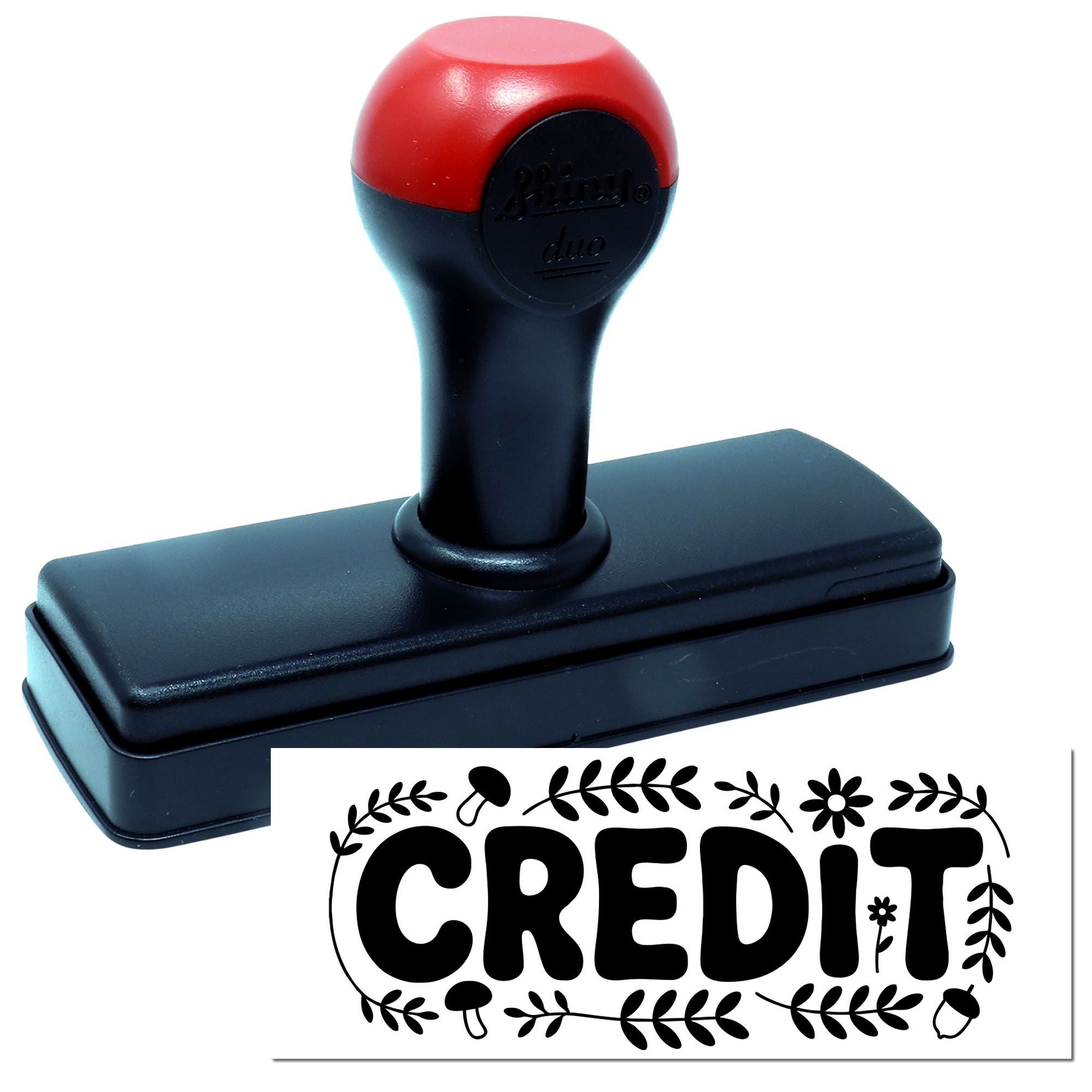 Self-inking rubber stamp with CREDIT imprint for bookkeeping, office filing, and payment processing.