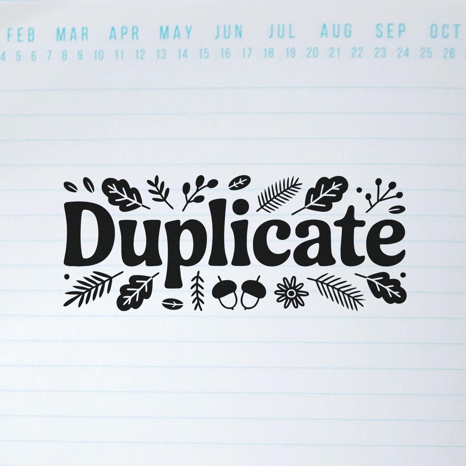 Botanical duplicate rubber stamp with leafy design for marking copies and duplicate documents.