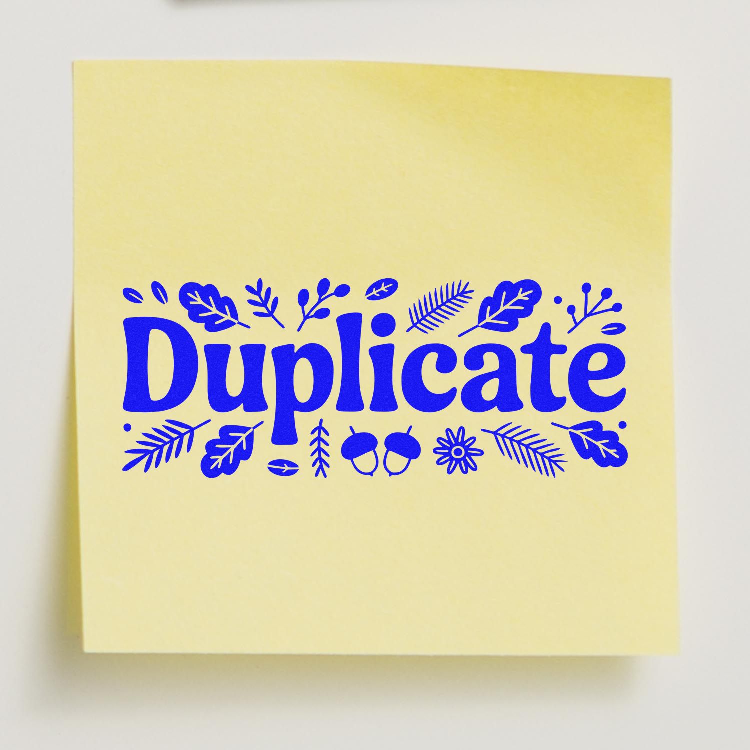 Duplicate rubber stamp design with blue leaf accents on yellow paper for office copy marking and document labeling.