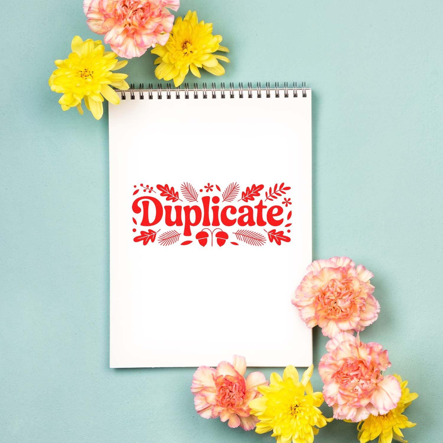 Decorative Duplicate rubber stamp design on a notebook page, framed by flowers, for office and craft labeling.
