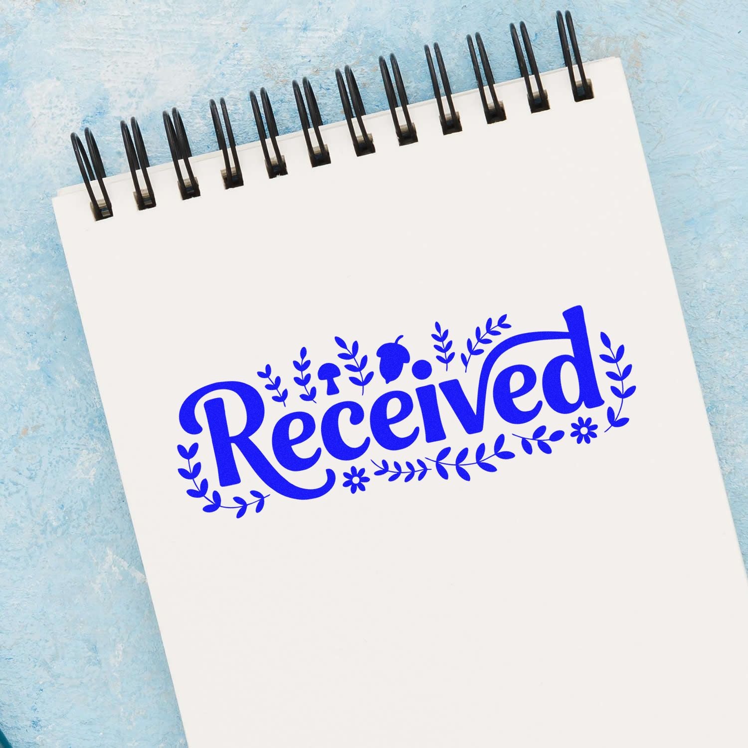 Decorative Received rubber stamp impression on spiral notepad for office mail and inventory tracking