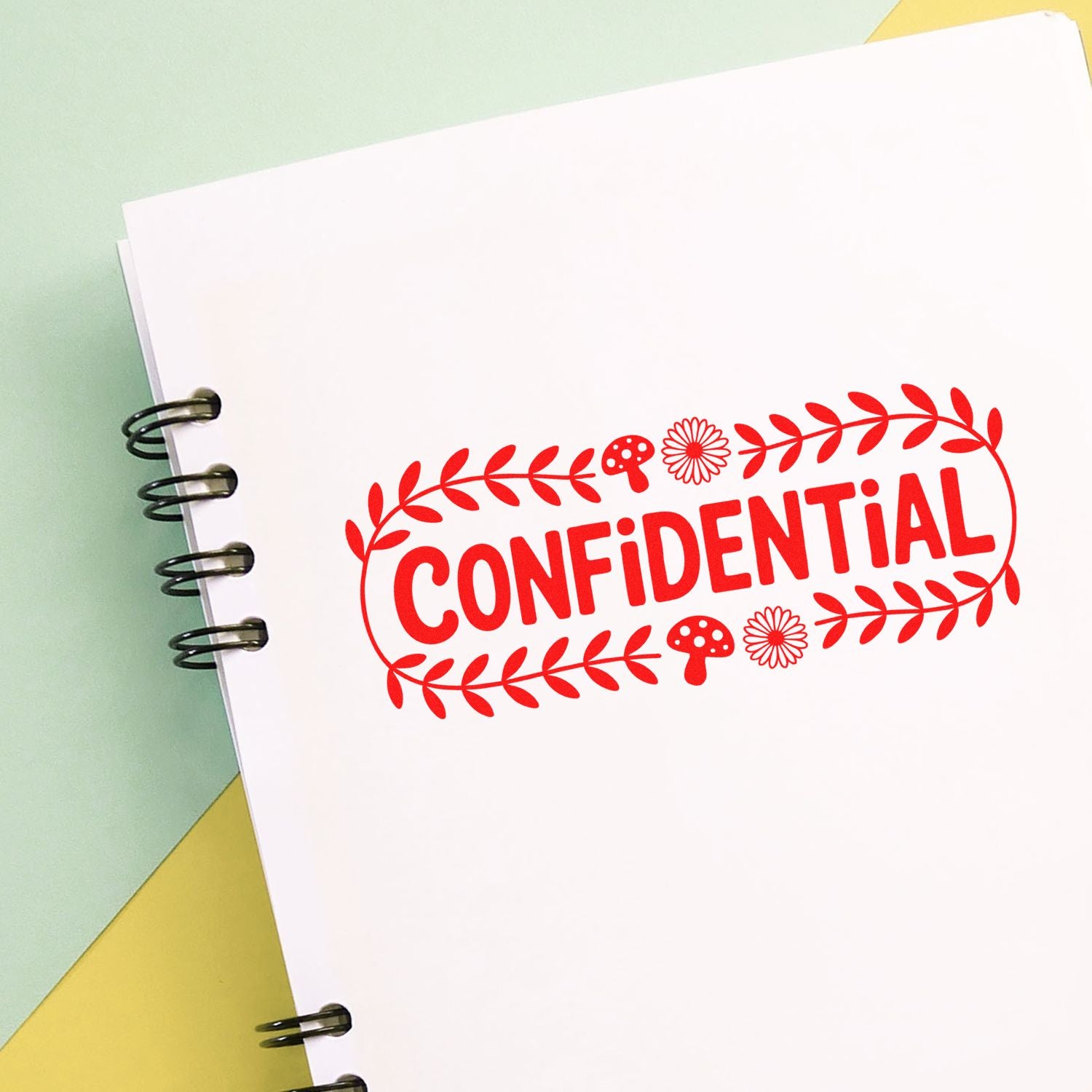 Confidential rubber stamp design for office documents, with floral border on notebook paper.