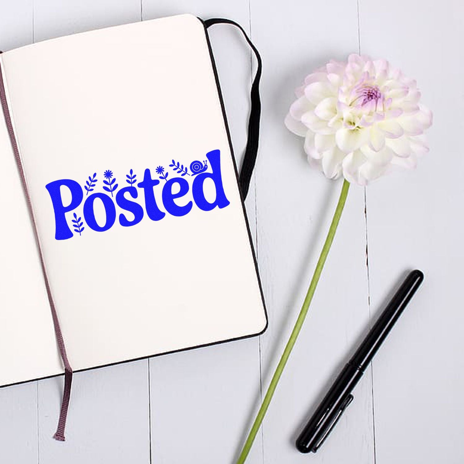 Posted rubber stamp design mockup with decorative blue lettering for planners, notebooks, and office organization.