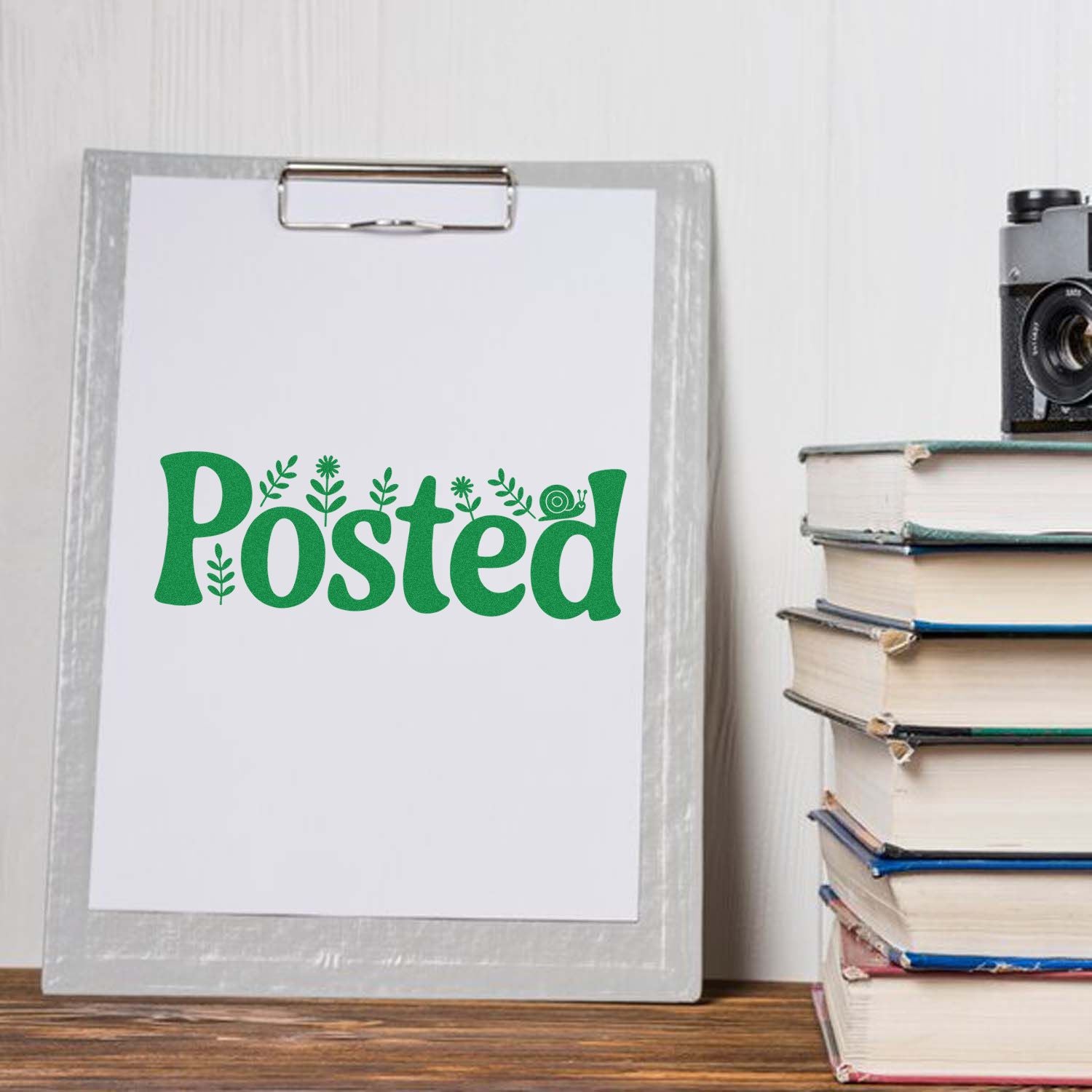 Custom Posted rubber stamp design on clipboard, perfect for mail, stationery, and office organization.