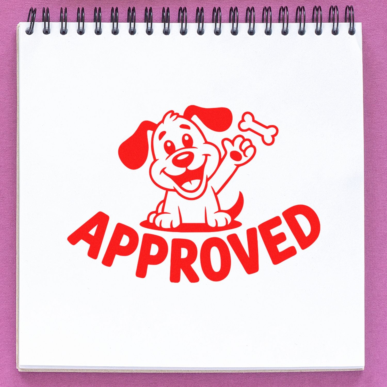 Approved rubber stamp featuring a happy dog and bone, red imprint on notebook page.