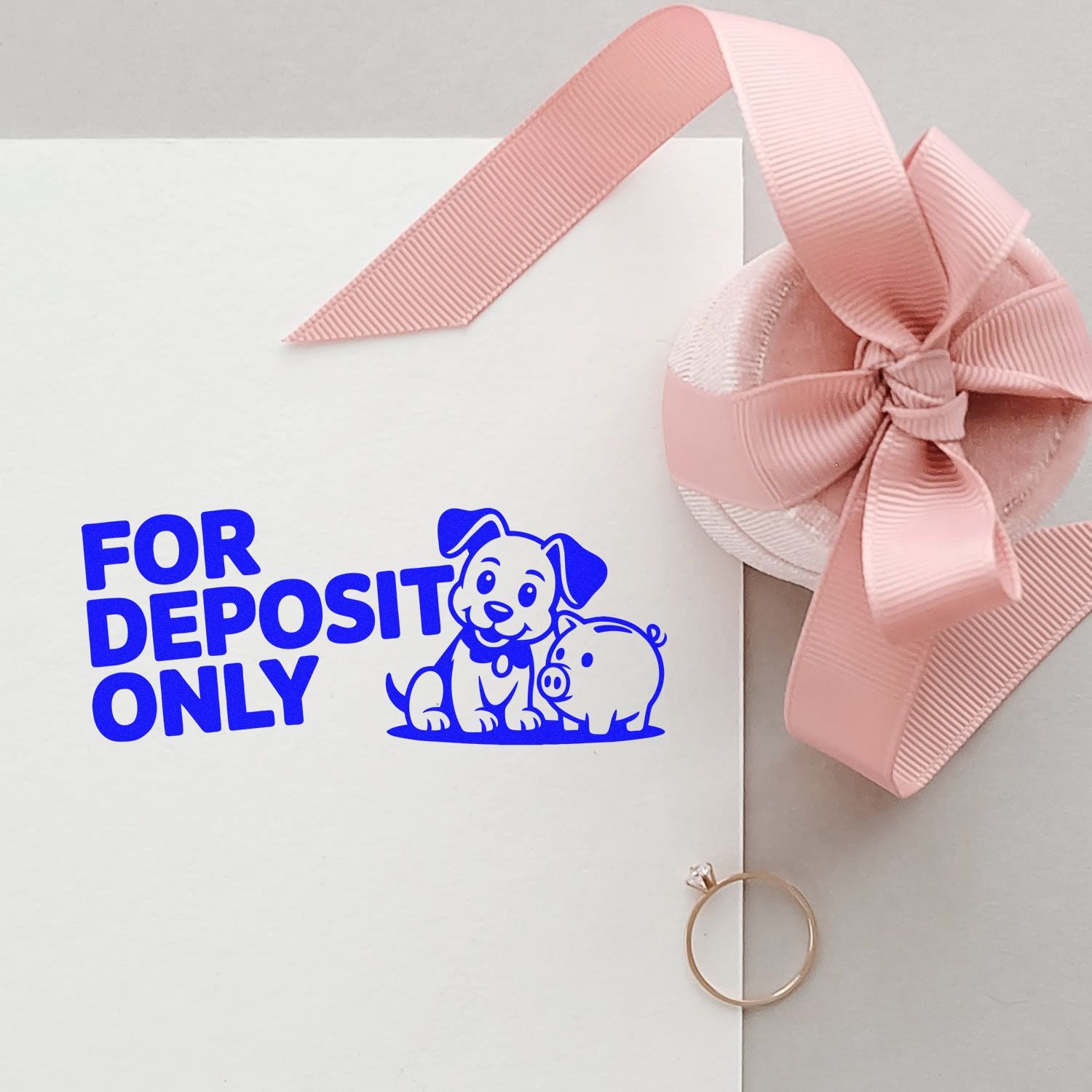 For Deposit Only rubber stamp impression on white envelope, featuring dog and pig design with pink ribbon, ideal for bank deposit packaging.