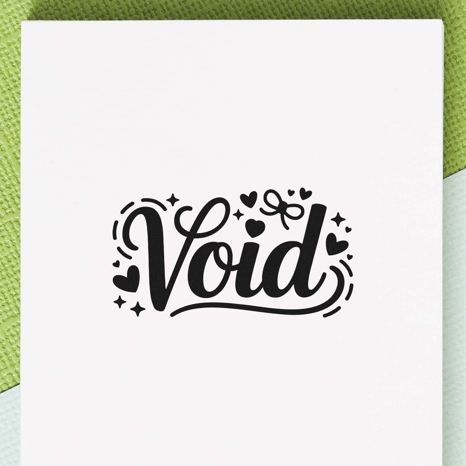 Void rubber stamp design with hearts and stars on white paper, ideal for crafting, journaling, and custom document marking.