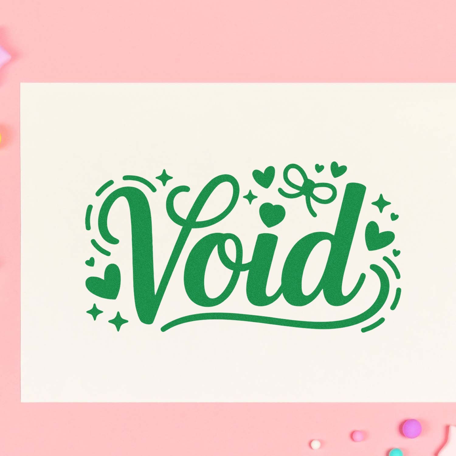 Void rubber stamp design in green script with hearts and sparkles on a cream card, ideal for craft, planner, and packaging use.
